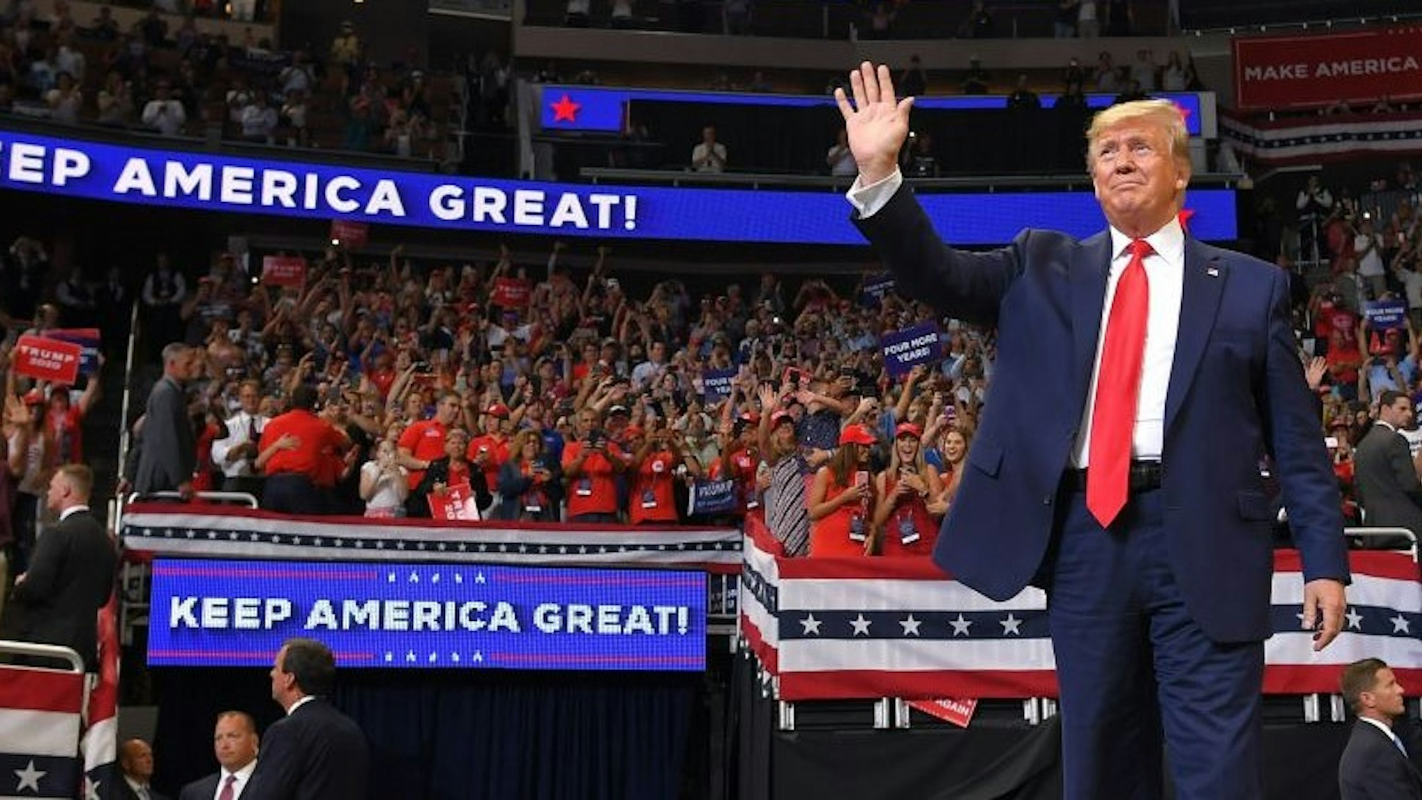 TOPSHOT - US President Donald Trump arrives to speak during a rally at the Amway Center in Orlando, Florida to officially launch his 2020 campaign on June 18, 2019. - Trump kicks off his reelection campaign at what promised to be a rollicking evening rally in Orlando. (Photo by MANDEL NGAN / AFP) (Photo by