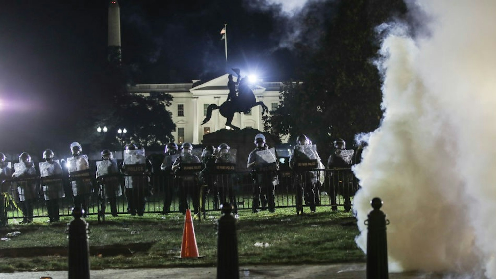 WASHINGTON, USA - JUNE 1: Police intervene in protesters with tear gas near White House during a protest over the death of George Floyd, an unarmed black man who died after being pinned down by a white police officer in Washington, United States on June 1, 2020. (Photo by