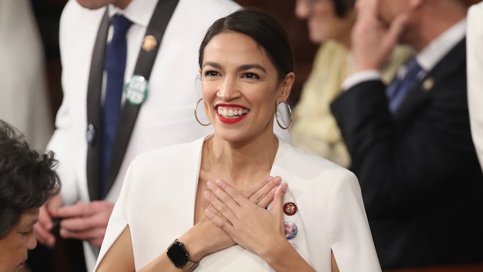 U.S. Rep. Alexandria Ocasio-Cortez (D-NY) greets fellow lawmakers ahead of the State of the Union address in the chamber of the U.S. House of Representatives on February 5, 2019 in Washington, DC.