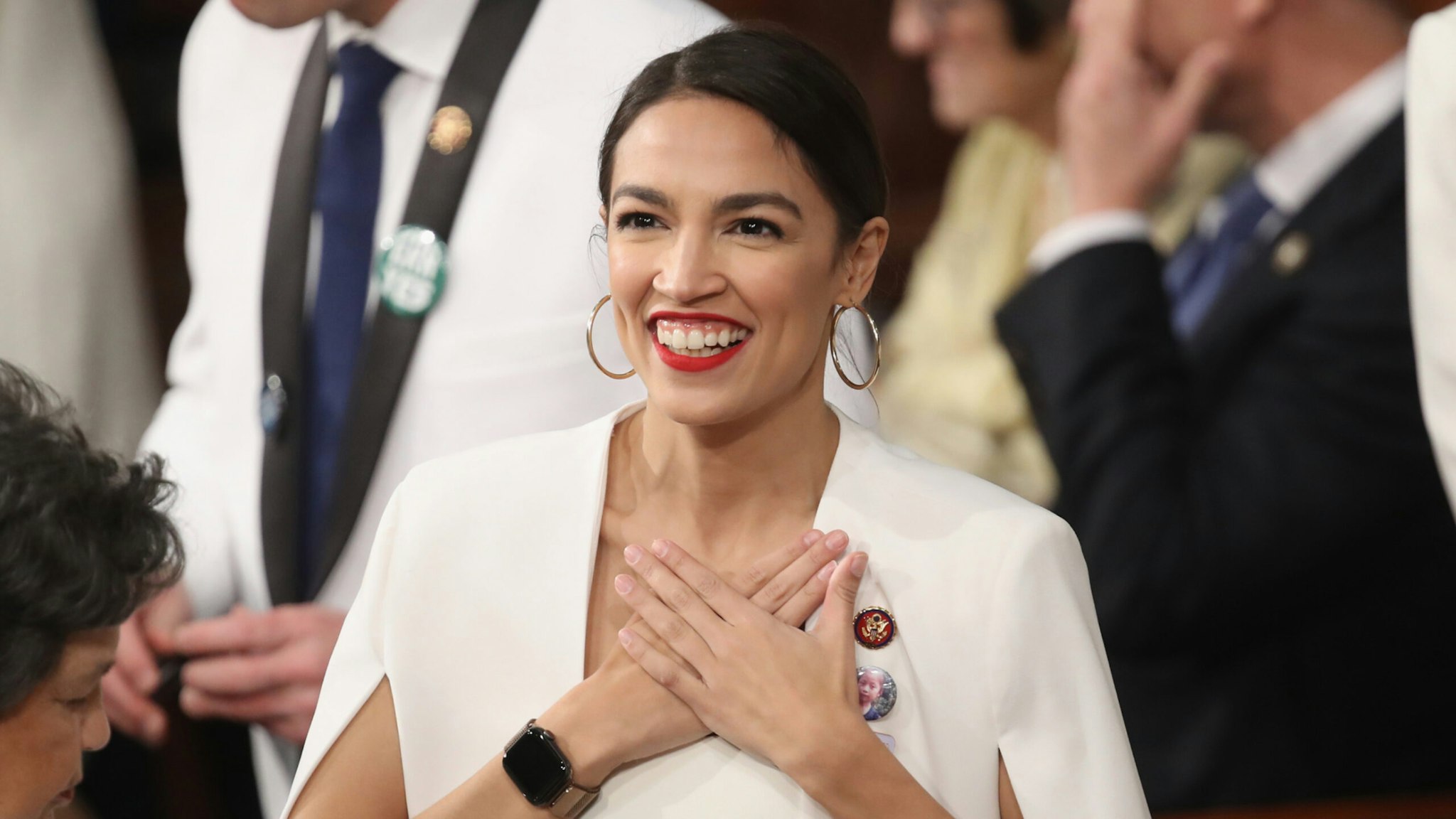 U.S. Rep. Alexandria Ocasio-Cortez (D-NY) greets fellow lawmakers ahead of the State of the Union address in the chamber of the U.S. House of Representatives on February 5, 2019 in Washington, DC.