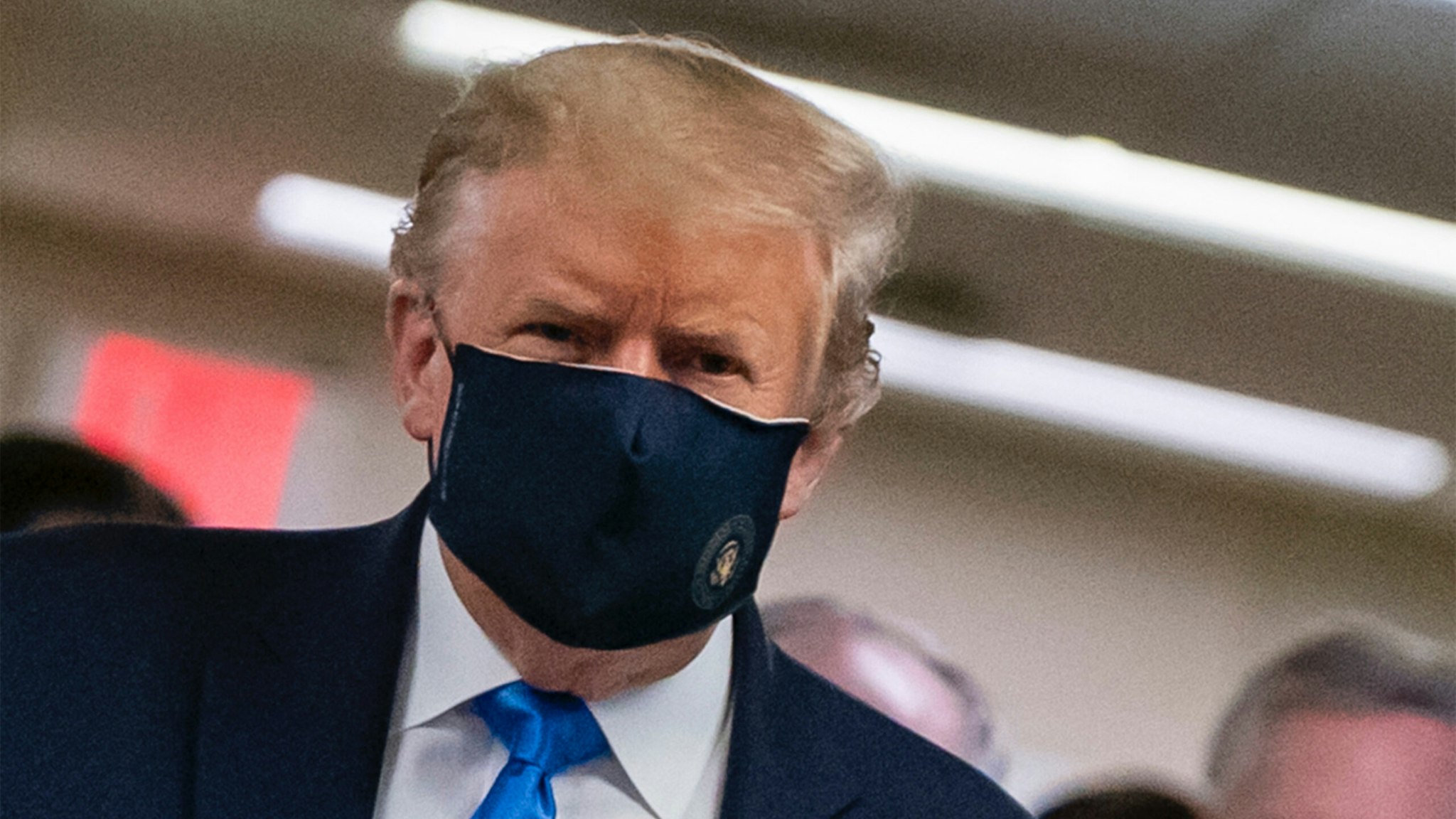 US President Donald Trump wears a mask as he visits Walter Reed National Military Medical Center in Bethesda, Maryland' on July 11, 2020.