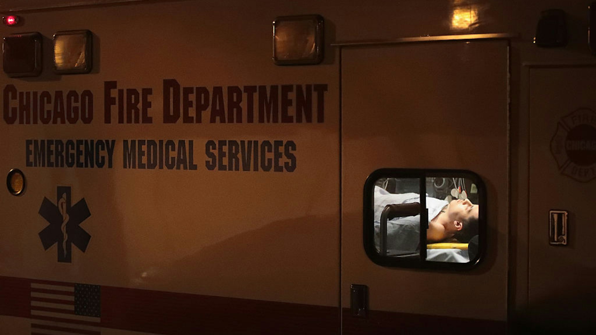 CHICAGO, IL - JANUARY 01: A man is pictured in an ambulance at the scene where two people were reported shot on January 1, 2017 in Chicago, Illinois. Chicago ended 2016 with more than 700 people shot and killed, making it one of the deadliest years in two decades. (Photo by Scott Olson/Getty Images)
