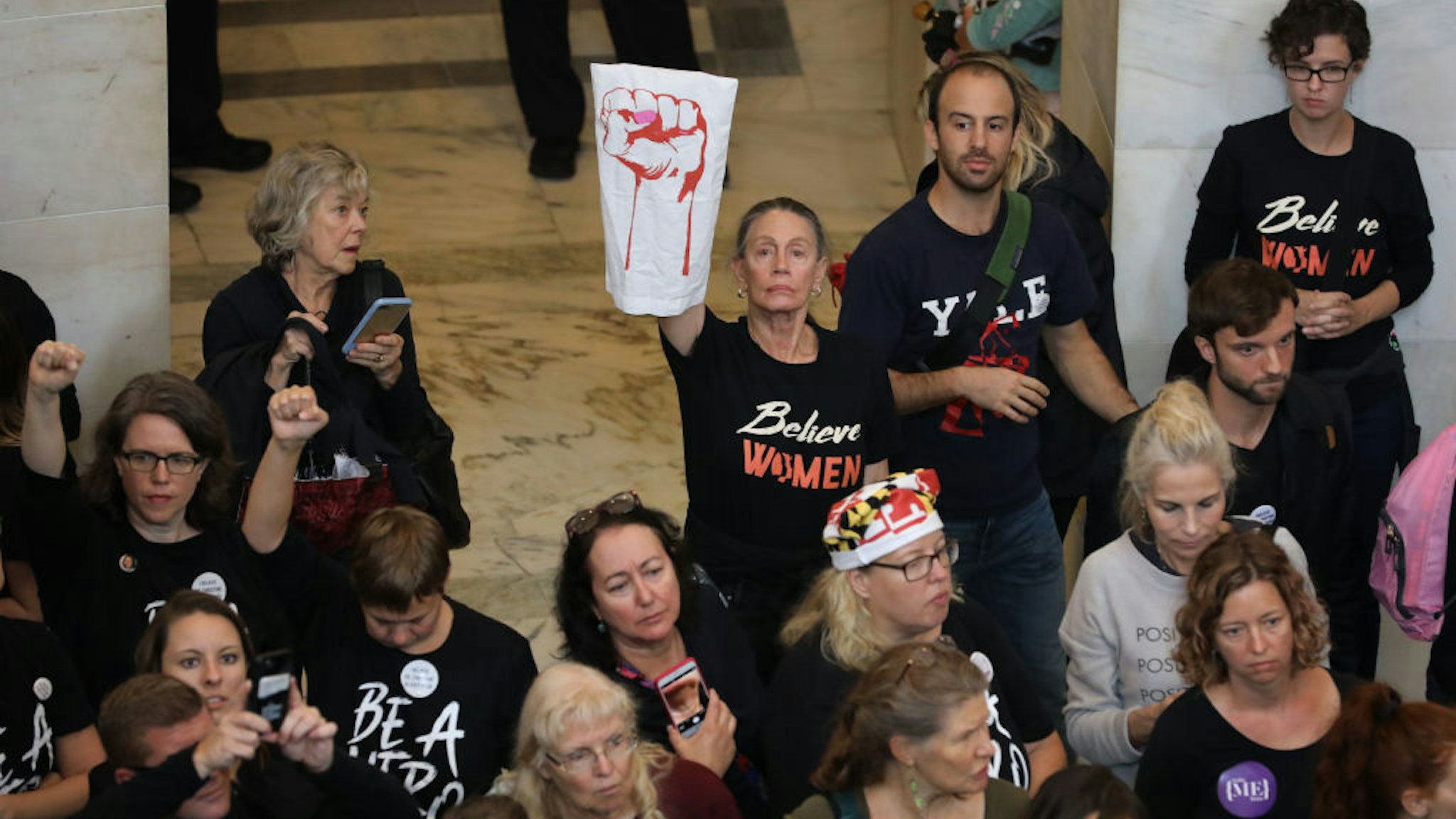 Hundreds of protesters rally in the Russell Senate Office Building Rotunda while demonstrating against the confirmation of Judge Brett Kavanaugh on Capitol Hill September 24, 2018 in Washington, DC. Hundreds of people from half a dozen progressive organizations, including students from Yale University Law School, protested on Capitol Hill for a #BelieveSurvivors Walkout against Judge Kavanaugh, who has been accused by at least two women of sexual assault. (Photo by Chip Somodevilla/Getty Images)