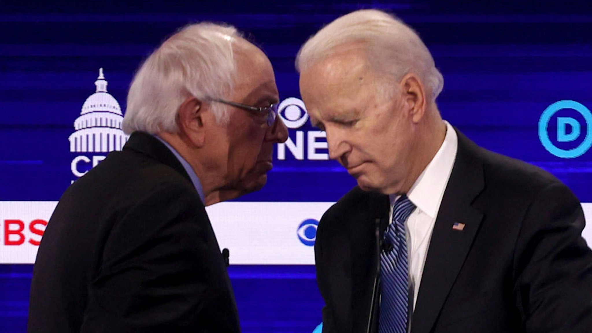 CHARLESTON, SOUTH CAROLINA - FEBRUARY 25: Democratic presidential candidates Sen. Bernie Sanders (I-VT) (L) and former Vice President Joe Biden speak during a break at the Democratic presidential primary debate at the Charleston Gaillard Center on February 25, 2020 in Charleston, South Carolina. Seven candidates qualified for the debate, hosted by CBS News and Congressional Black Caucus Institute, ahead of South Carolina‚Äôs primary in four days.