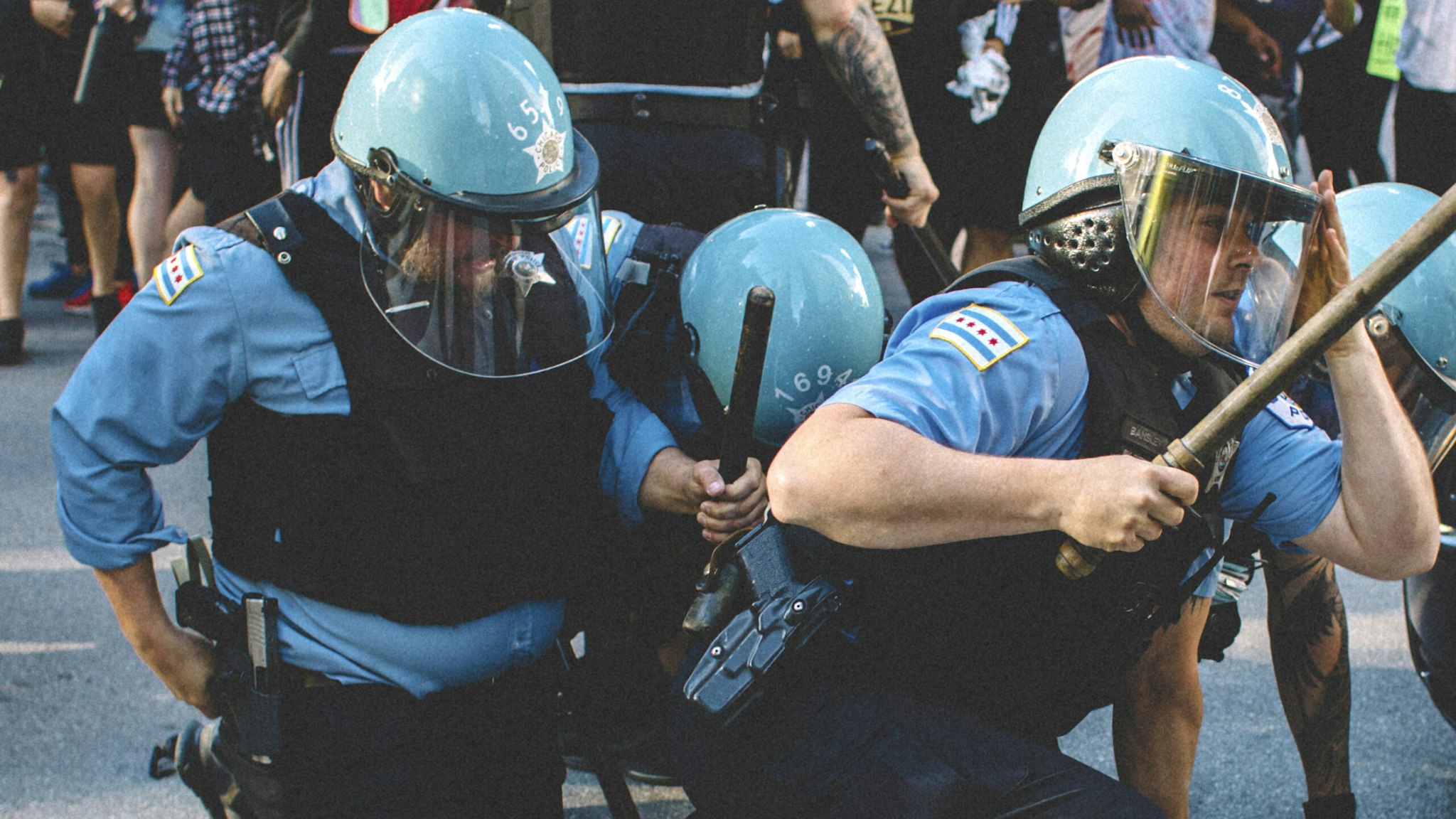 Protesters clash with police in Chicago , on May 30, 2020 during a protest against the death of George Floyd, an unarmed black man who died while while being arrested and pinned to the ground by the knee of a Minneapolis police officer.