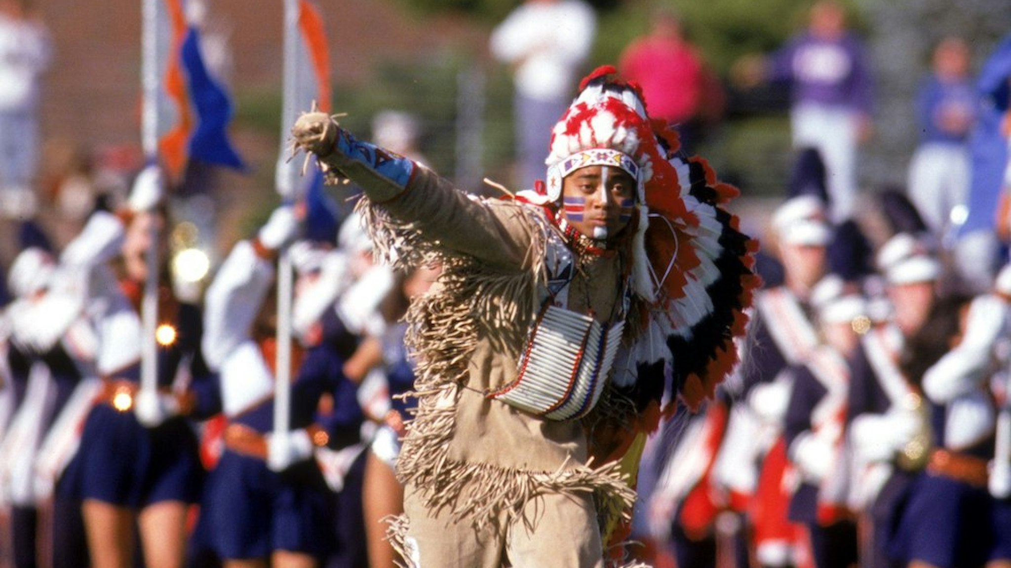 The Illinois Fighting Illini mascot Chief Illiniwek performs during the game against the Houston Cougars at Memorial Stadium on September 21, 1991 in Champaign, Illinois. Illinois won 51-10. (Photo by Bernstein Associates/Getty Images)