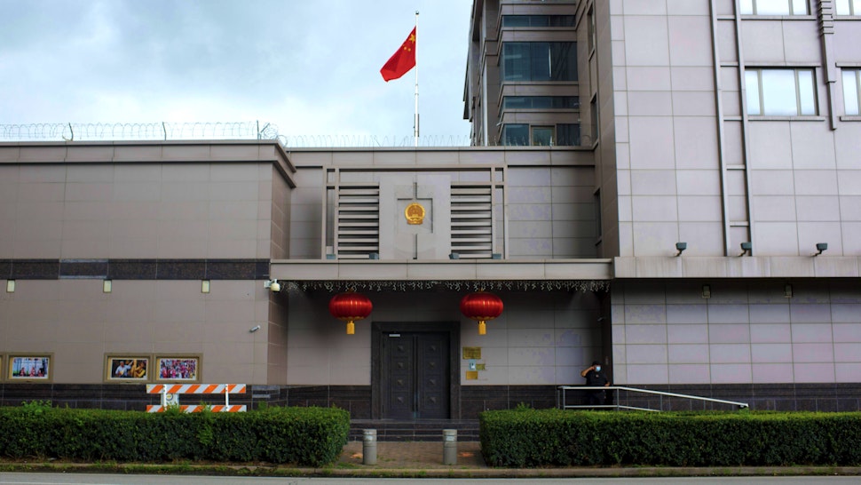 The Chinese flag flies outside of the Chinese consulate in Houston after the US State Department ordered China to close the consulate in Houston, Texas, July 22, 2020. - US-Chinese tensions, already rising because of the coronavirus pandemic and crackdown in Hong Kong, ratcheted up another notch on Wednesday as the US ordered the closure of the Chinese consulate in Houston within 72 hours. China reacted angrily to the US move, which came a day after the unveiling of a US indictment of two Chinese nationals for allegedly hacking hundreds of companies worldwide.