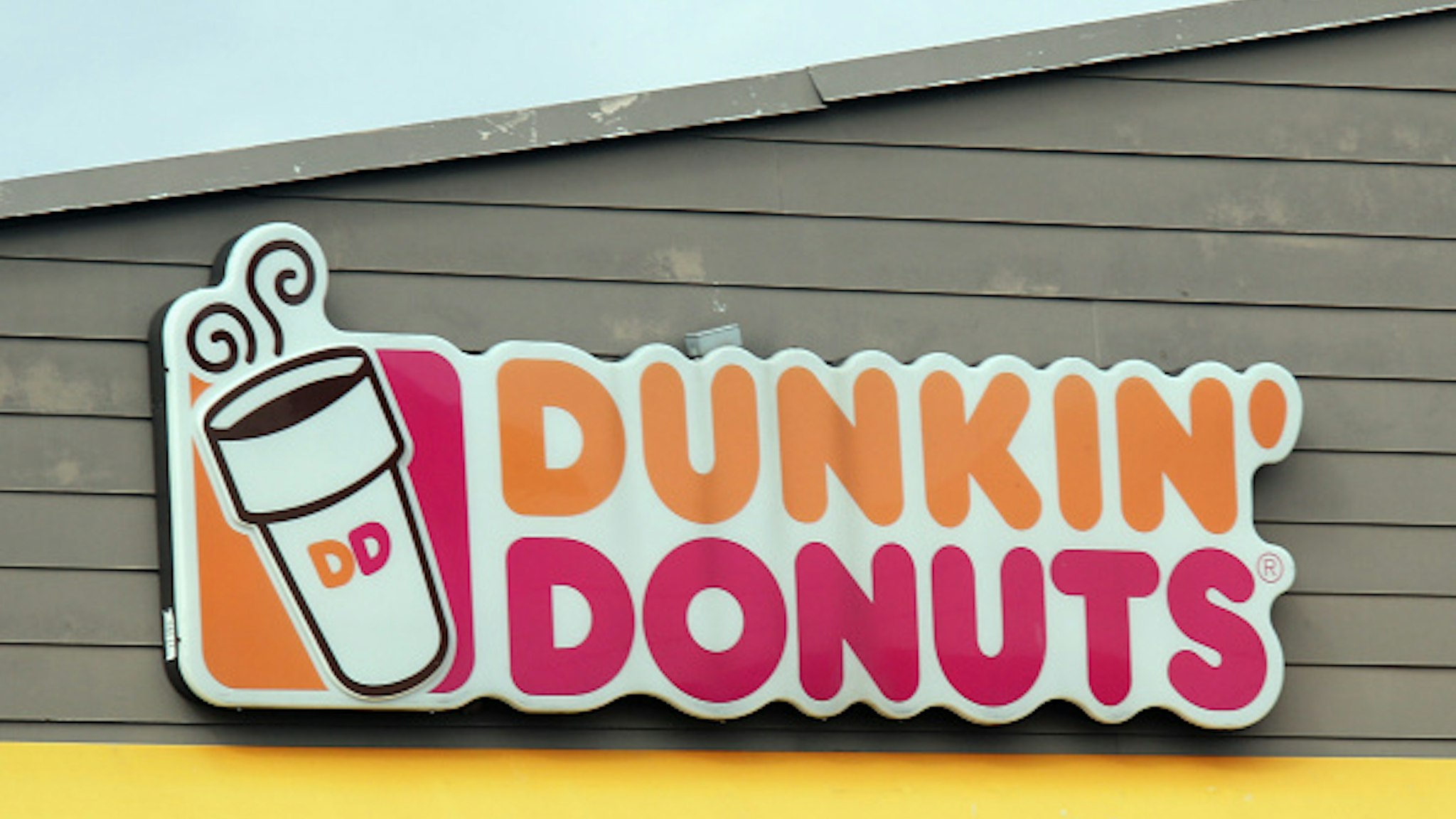 LEVITTOWN, NEW YORK - MARCH 16: An image of the sign for Dunkin' Donuts as photographed on March 16, 2020 in Levittown, New York.