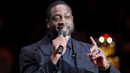 Cleveland Cavaliers v Miami Heat MIAMI, FLORIDA - FEBRUARY 22: Former Miami Heat player Dwyane Wade addresses the crowd during his jersey retirement ceremony at American Airlines Arena on February 22, 2020 in Miami, Florida.