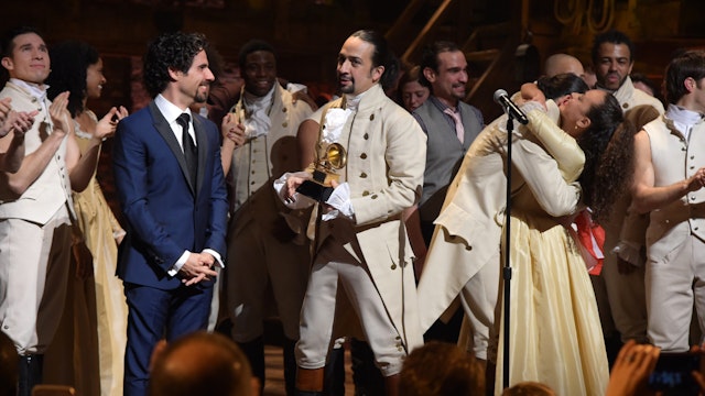 Music director Alex Lacamoire and actor, composer Lin-Manuel Miranda and cast of "Hamilton" celebrate on stage the receiving of GRAMMY award after "Hamilton" GRAMMY performance for The 58th GRAMMY Awards at Richard Rodgers Theater on February 15, 2016 in New York City.