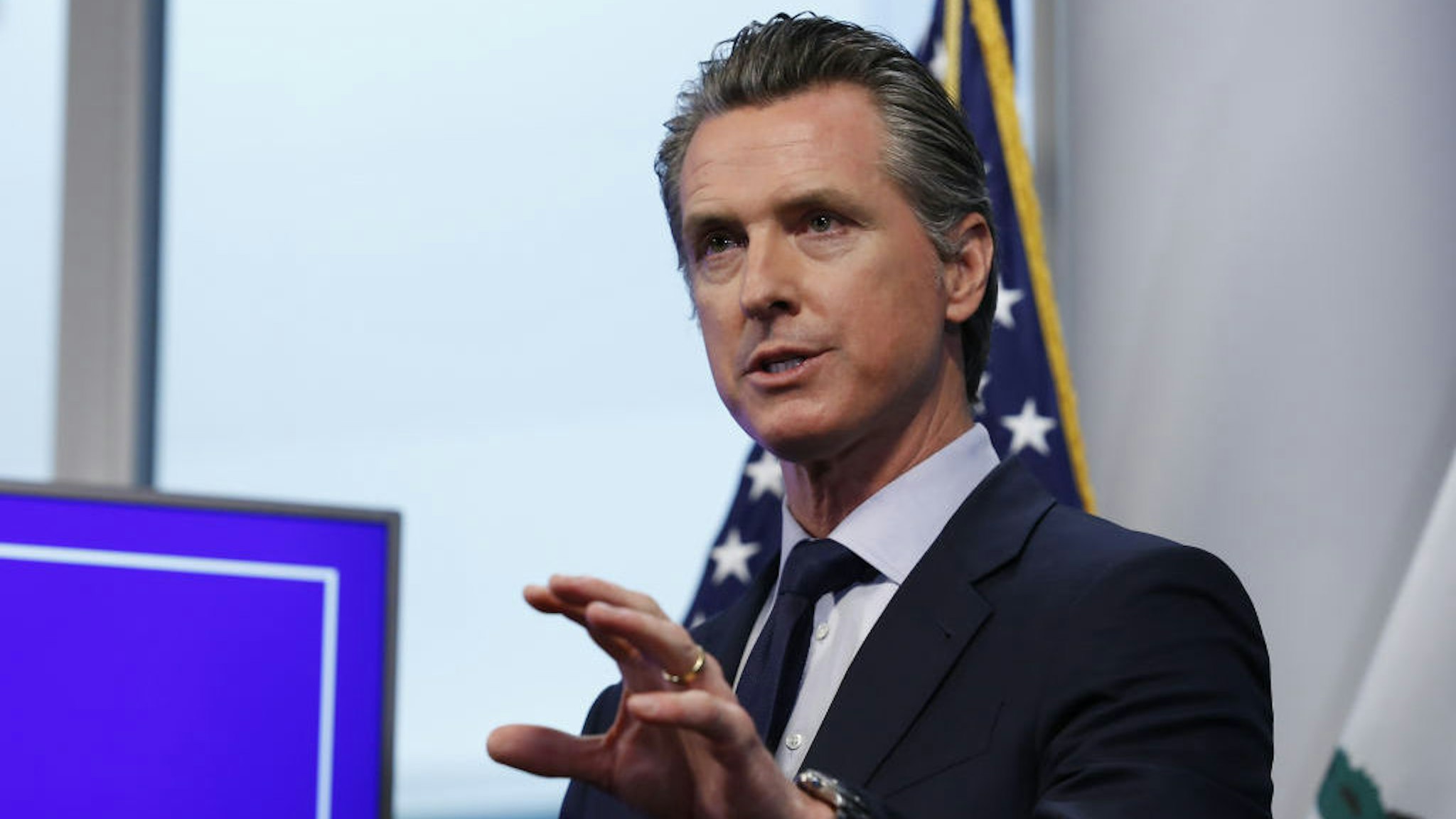 Gavin Newsom, governor of California, speaks during a news conference in Sacramento, California, U.S., on Tuesday, April 14, 2020. Newsom outlined his plan to lift restrictions in the most-populous U.S. state, saying a reopening depends on meeting a series of benchmarks that would remake daily life for 40 million residents. Photographer: Rich Pedroncelli/AP/Bloomberg