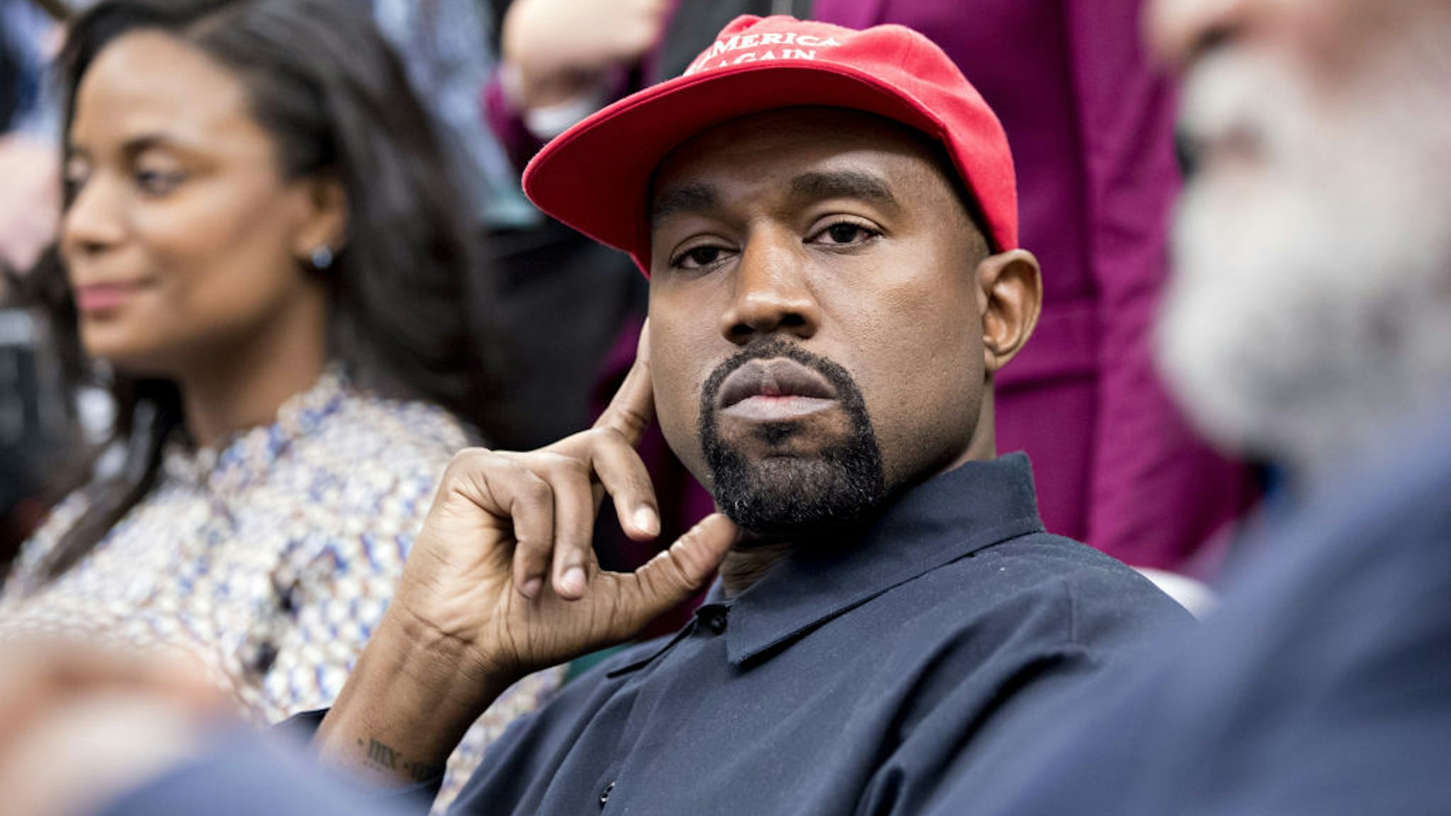 Rapper Kanye West listens during a meeting with U.S. President Donald Trump, not pictured, in the Oval Office of the White House in Washington, D.C., U.S., on Thursday, Oct. 11, 2018.