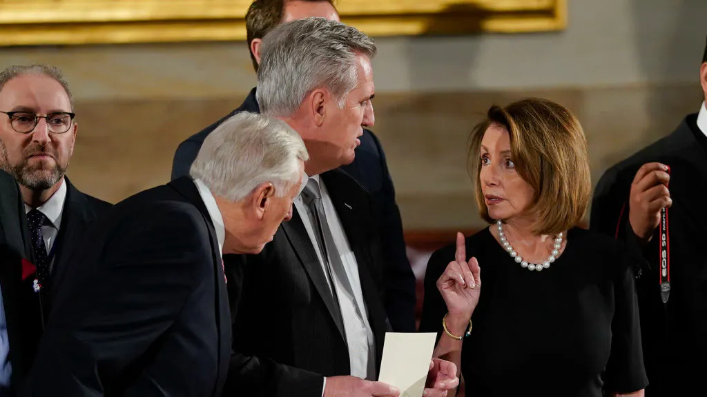 House Minority Leader Nancy Pelosi (D-CA) talks with House Majority Leader Kevin McCarthy (R-CA) (C) and House Minority Whip Steny Hoyer, (D-Md) (L), as they arrive at the U.S Capitol Rotunda on December 03, 2018 in Washington, DC