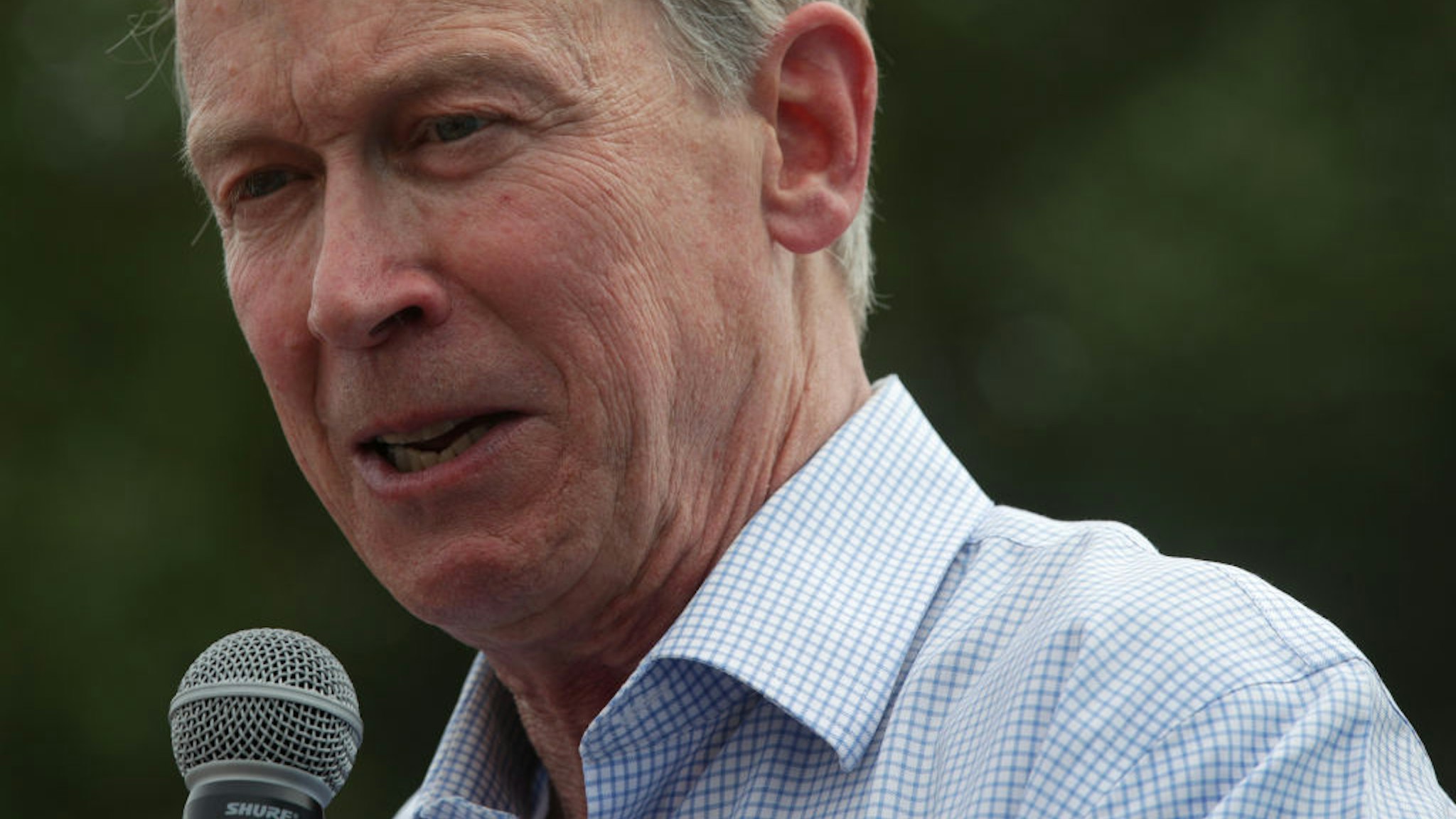 Democratic presidential candidate and former Governor of Colorado John Hickenlooper delivers a campaign speech at the Des Moines Register Political Soapbox at the Iowa State Fair on August 10, 2019 in Des Moines, Iowa.