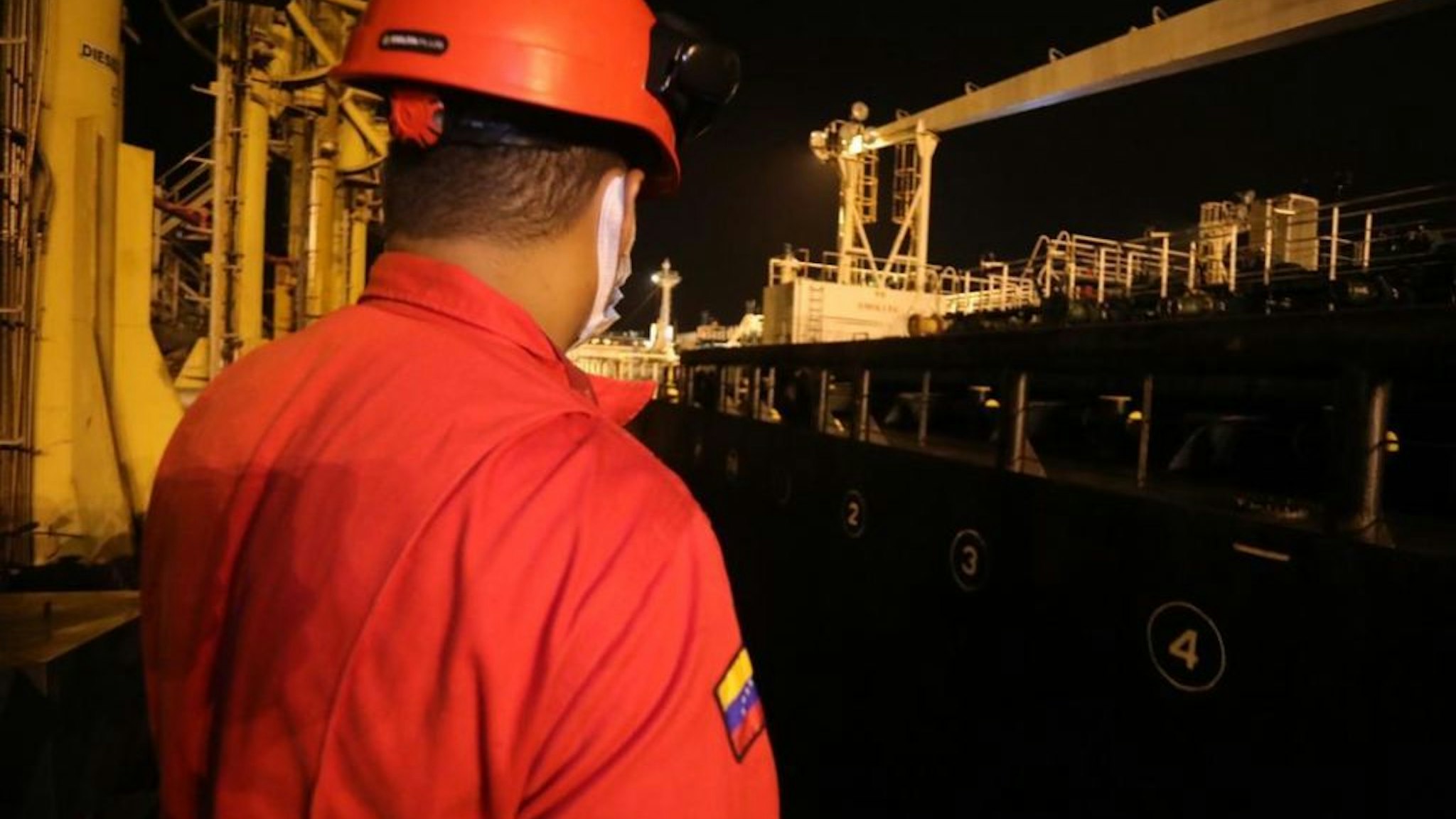 Worker is seen at Iranian flagged fuel tanker 'Fortune' after it was docked at El Palito refinery in Puerto Cabello, state of Carabobo, Venezuela, on May 26, 2020.