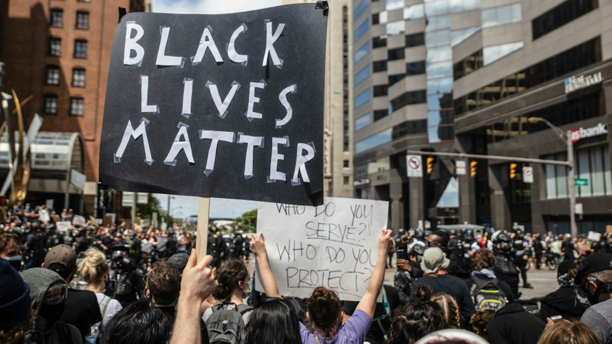 A protester holds a placard that says Black Lives Matter during the demonstration.