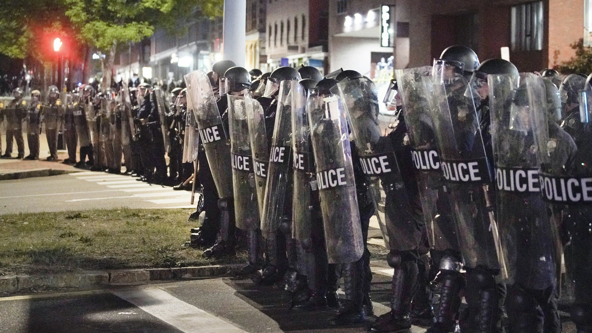PORTLAND, ME - JUNE 2: Police in riot gear form a line across Franklin Arterial on Tuesday night. (Staff Photo by Gregory Rec/Portland Press Herald via Getty Images)