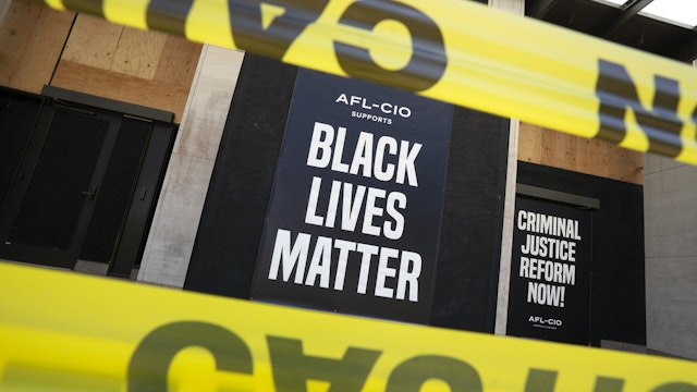 A Black Lives Matter sign is displayed on the American Federation of Labor and Congress of Industrial Organizations (AFL-CIO) building near the White House in Washington, D.C., U.S., on Sunday, June 14, 2020. Atlanta Police Chief Erika Shields resigned Saturday after an officer fatally shot a black man the night before in a Wendy's parking lot. Photographer: Stefani Reynolds/Bloomberg via Getty Images