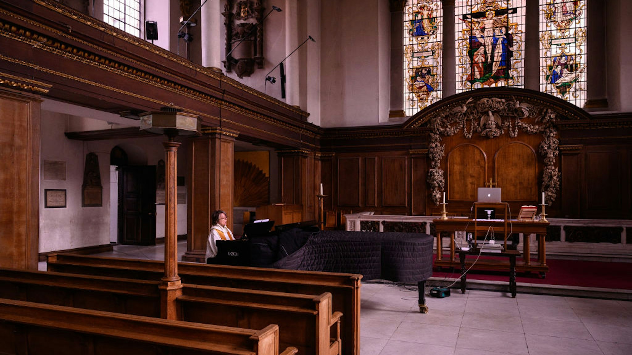 The reverend Lucy Winkett, rector of St James's Piccadilly, plays piano as she sings a hymn during the service on Rogation Sunday via webcam to the church's congregation on May 17, 2020 in London, England.