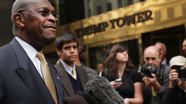 Republican presidential candidate Herman Cain speaks to the media outside of Trump Towers before a scheduled appearance with real estate mogul Donald Trump on October 3, 2011 in New York City.