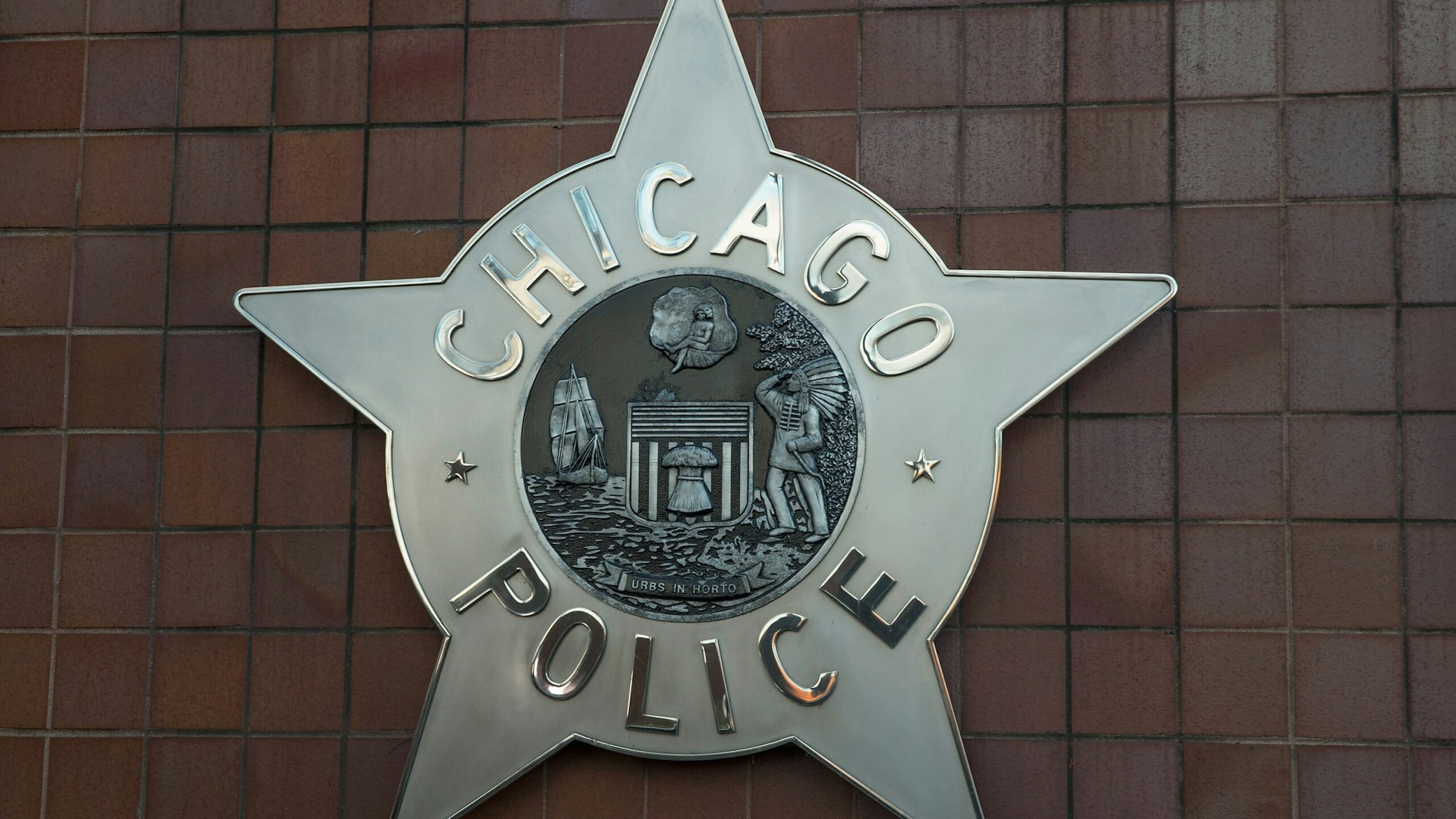 CHICAGO, IL - DECEMBER 01: A Chicago police badge hangs in front of the City of Chicago Public Safety Headquarters on December 1, 2015 in Chicago, Illinois. Following public outcry over the way police handled the shooting death of Laquan McDonald by Chicago police officer Jason Van Dyke, Mayor Rahm Emanuel today announced he had fired Chicago Police Superintendant Garry McCarthy. McCarthy, Emanuel and Cook County States Attorney Anita Alvarez have been accused of trying to cover up the shooting. (Photo by Scott Olson/Getty Images)