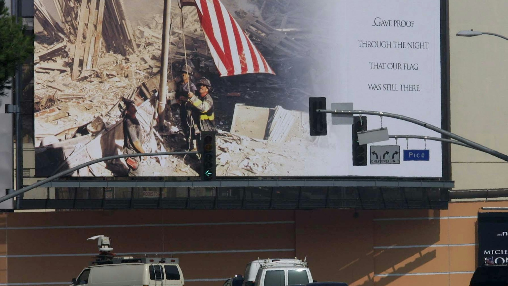 A huge mural showing a picture of firefighters raising the US flag over the ruins of the World Trade Center is displayed outside the 20th Century Fox Studio in Los Angeles 21 September 2001.