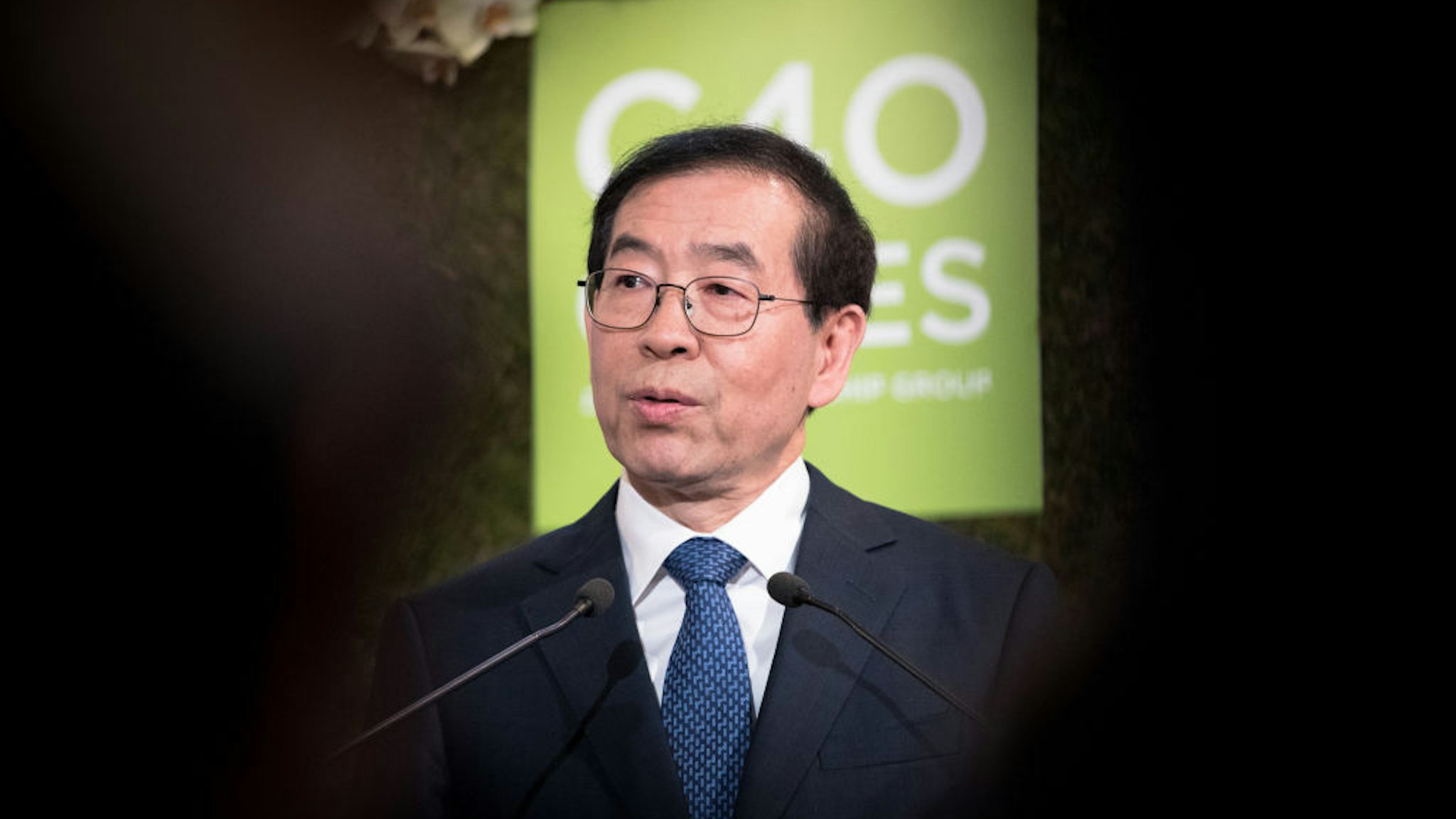 Mayor of Seoul, Park Won soon delivers a speech next to the Mayor of London, Sadiq Khan (not pictured) and Mayor of Paris and Head of C40 (a grouping of 90 megacities that want to act for the climate), Anne Hidalgo (not pictured) at the City Hall on March 29, 2017 in Paris, France.