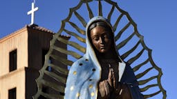 Southwest USA scenes SANTA FE, NM - NOVEMBER 11, 2017: A bronze statue of Our Lady of Guadalupe stands beside the historic Santuario de Guadalupe in Santa Fe, New Mexico. Our Lady of Guadalupe (The Shrine of Our Lady of Guadalupe) was built in the 1770s. It is the oldest standing shrine in the United States. (Photo by Robert Alexander/Getty Images)