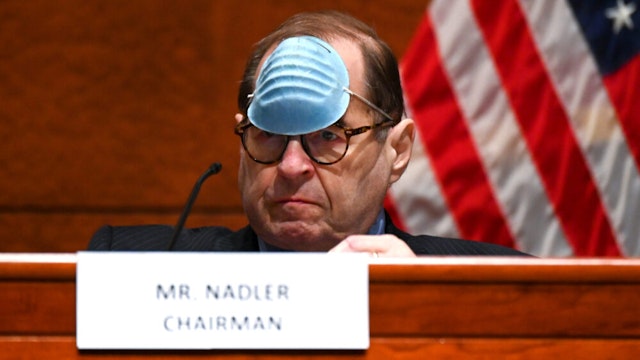 WASHINGTON, DC - JUNE 17: Representative Jerry Nadler, a Democrat from New York and chairman of the House Judiciary Committee, adjusts his mask to drink a beverage during a markup on H.R. 7120, the "Justice in Policing Act of 2020," on June 17, 2020, in Washington, D.C. The House bill would make it easier to prosecute and sue officers and would ban federal officers from using choke holds, bar racial profiling, end "no-knock" search warrants in drug cases, create a national registry for police violations, and require local police departments that get federal funds to conduct bias training.