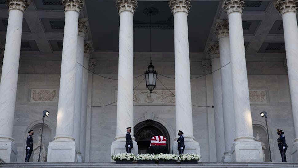 Visitors gather to pay their respects as the American flag-draped casket of the late Representative John Lewis sits on the steps of the U.S. Capitol in Washington, D.C., U.S., on Monday, July 27, 2020. Lewis, a civil rights leader who was one of the original Freedom Riders and became a leading liberal voice for decades in the U.S. House of Representatives, died on July 17 at the age of 80. Photographer: