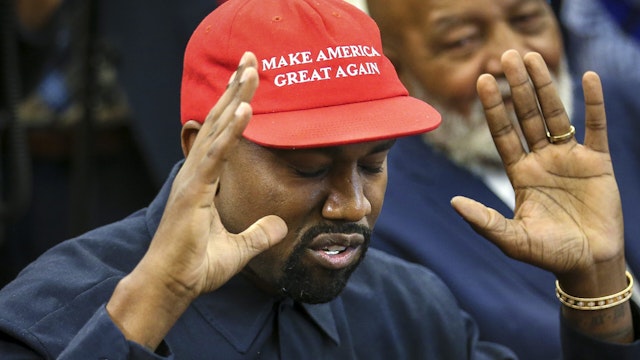 WASHINGTON, DC - OCTOBER 11: (AFP OUT) Rapper Kanye West speaks during a meeting with U.S. President Donald Trump in the Oval office of the White House on October 11, 2018 in Washington, DC.