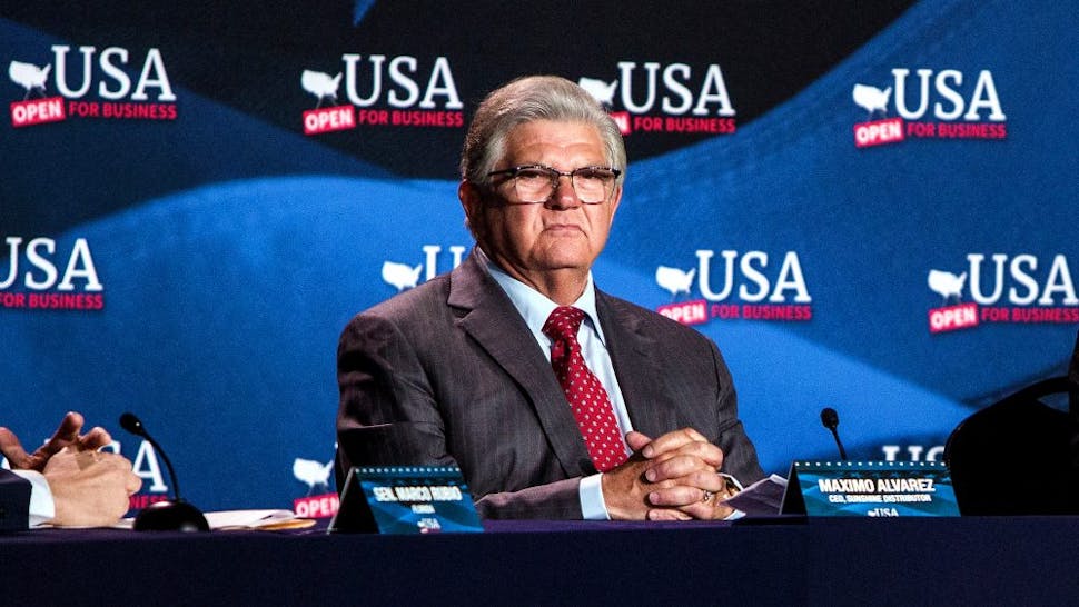 President Trump Holds Roundtable Discussion On Tax Reform U.S. President Donald Trump, right, speaks while Senator Marco Rubio, a Republican from Florida, left, and Maximo Alvarez, president of Sunshine Gasoline Distributors, listen during a roundtable discussion on tax cuts for Florida small businesses in Hialeah, Florida, U.S., on Monday, April 16, 2018. Trump accused China and Russia of devaluing their currencies, breaking from his own Treasury chief's view that no major trading partners are currency manipulators.