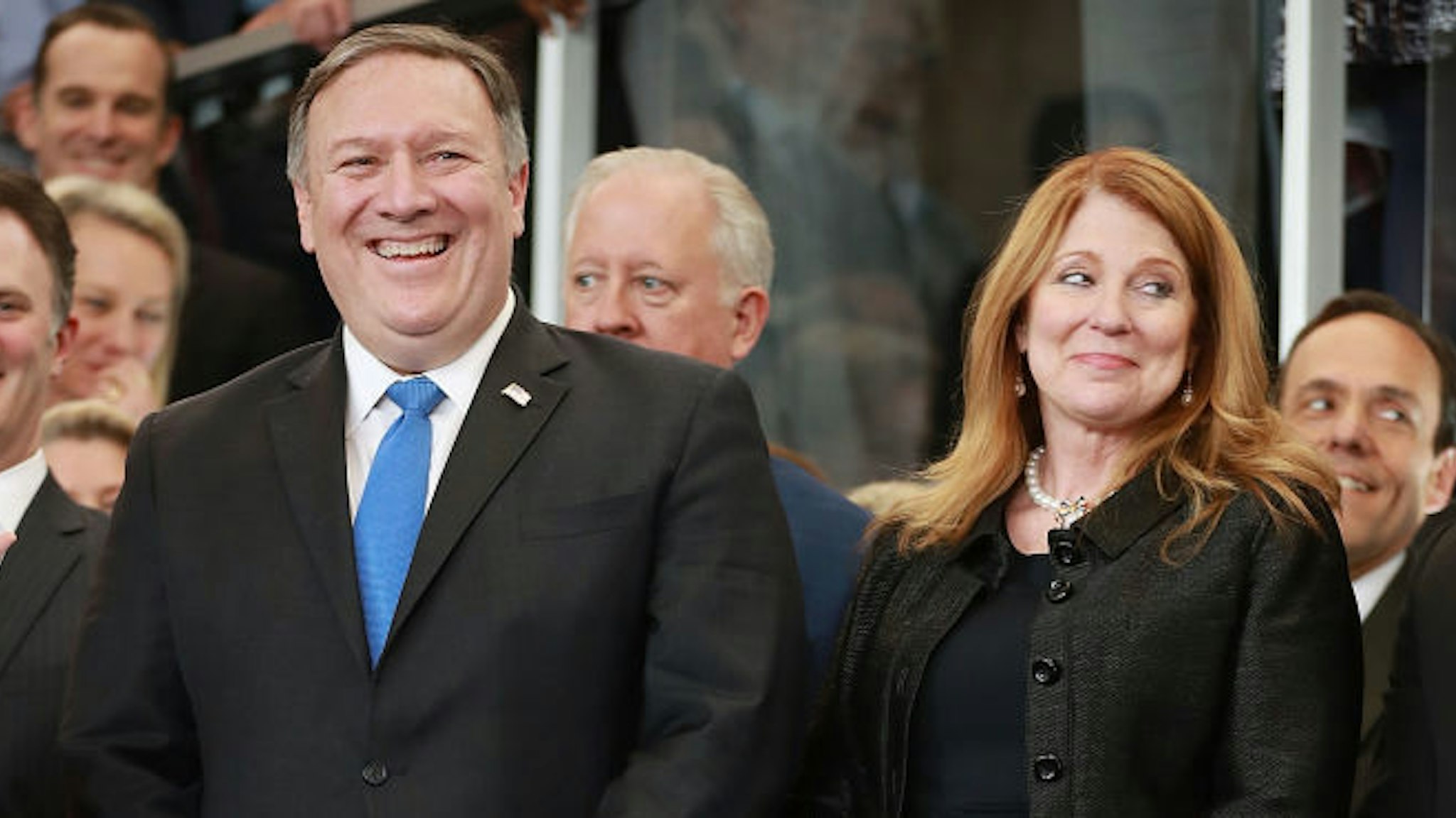 WASHINGTON, DC - MAY 01: U.S. Secretary of State Mike Pompeo (L) and his wife Susan Pompeo are welcomed to the State Department during a ceremony in the lobby of the Harry S. Truman Building May 1, 2018 in Washington, DC. Serving as director of the Central Intelligence Agency until he was sworn in as Secretary of State on April 26, Pompeo traveled to Israel, Jordan and Saudi Arabia before coming to State Department headquarters on Tuesday. (Photo by Chip Somodevilla/Getty Images)