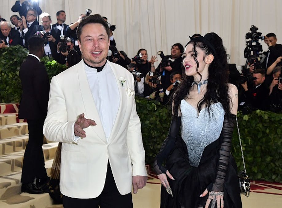 Elon Musk’s Partner Grimes Publicly Scolds Him After He Tweets ‘Pronouns Suck’