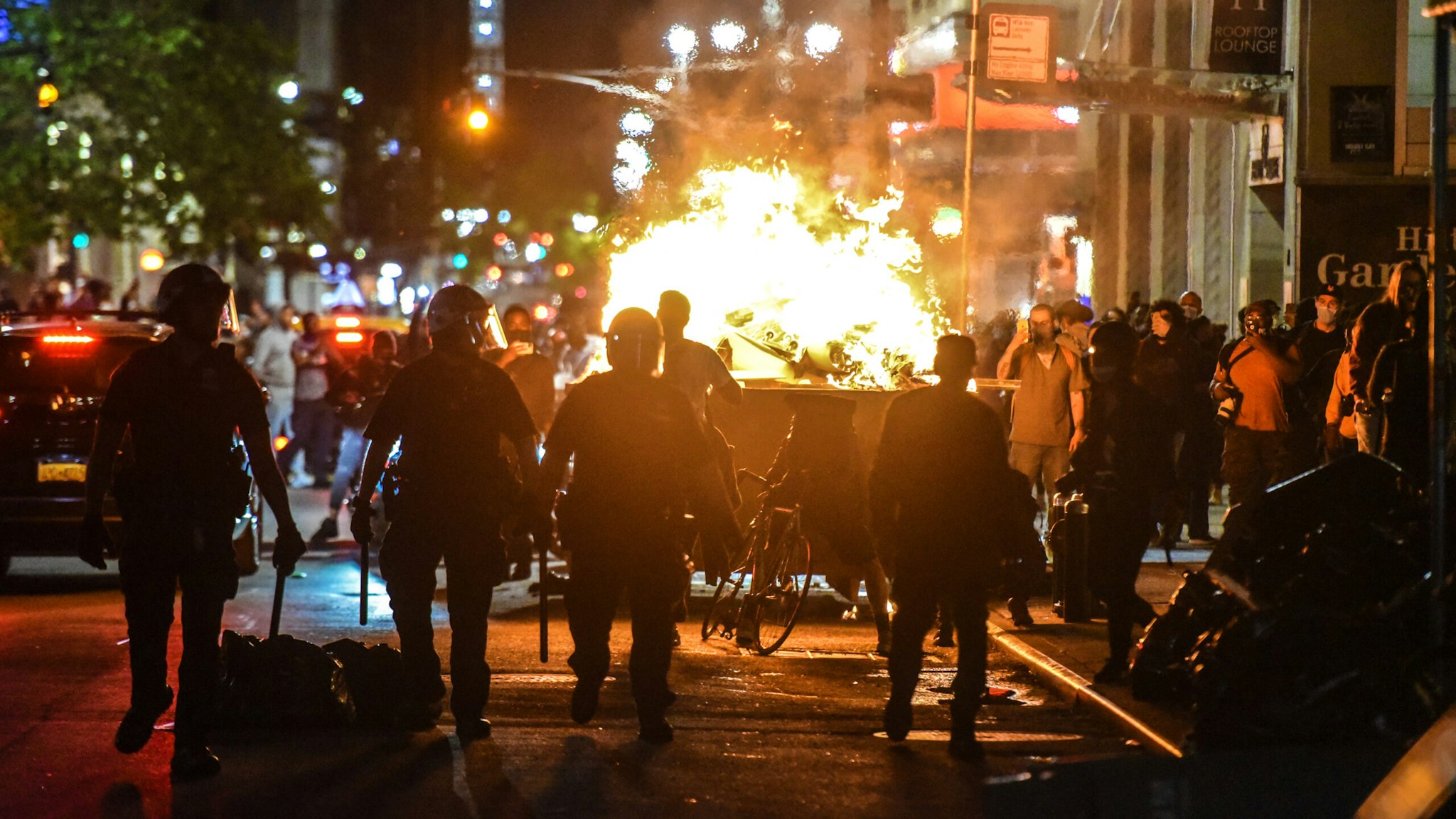 NEW YORK, NY - MAY 31: Protesters set a dumpster on fire on May 31, 2020 in New York City. Major cities across the United States have seen increased protests against police brutality and civil unrest since the death of George Floyd while in Minneapolis police custody.