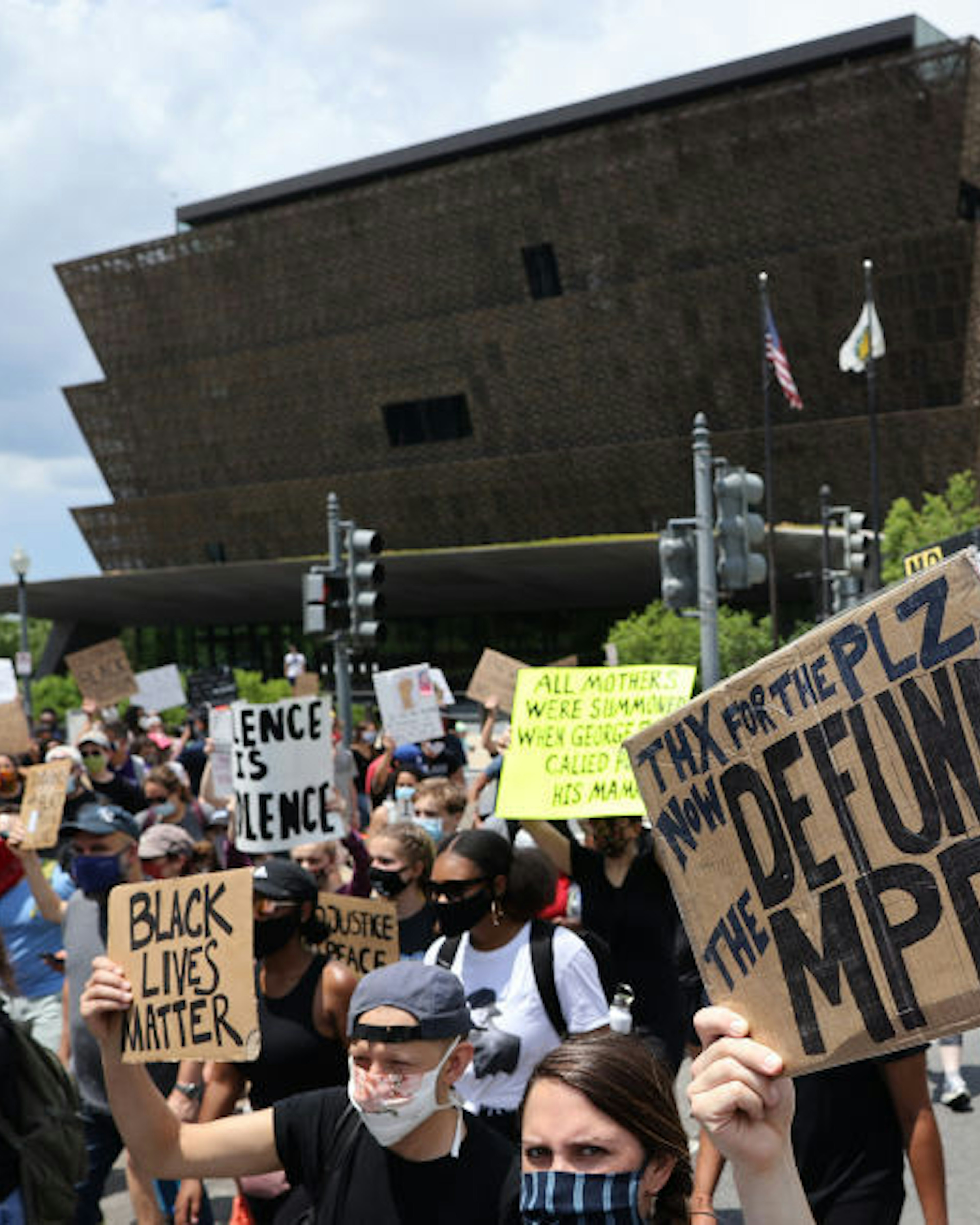Demonstrators march from The National Museum of African American History and Culture to the Martin Luther King Jr. Memorial to mark the Juneteenth holiday June 19, 2020 in Washington, DC. Juneteenth commemorates June 19, 1865, when a Union general read orders in Galveston, Texas stating all enslaved people in Texas were free according to federal law, effectively ending slavery in what remained of the Confederacy. (Photo by Chip Somodevilla/Getty Images)