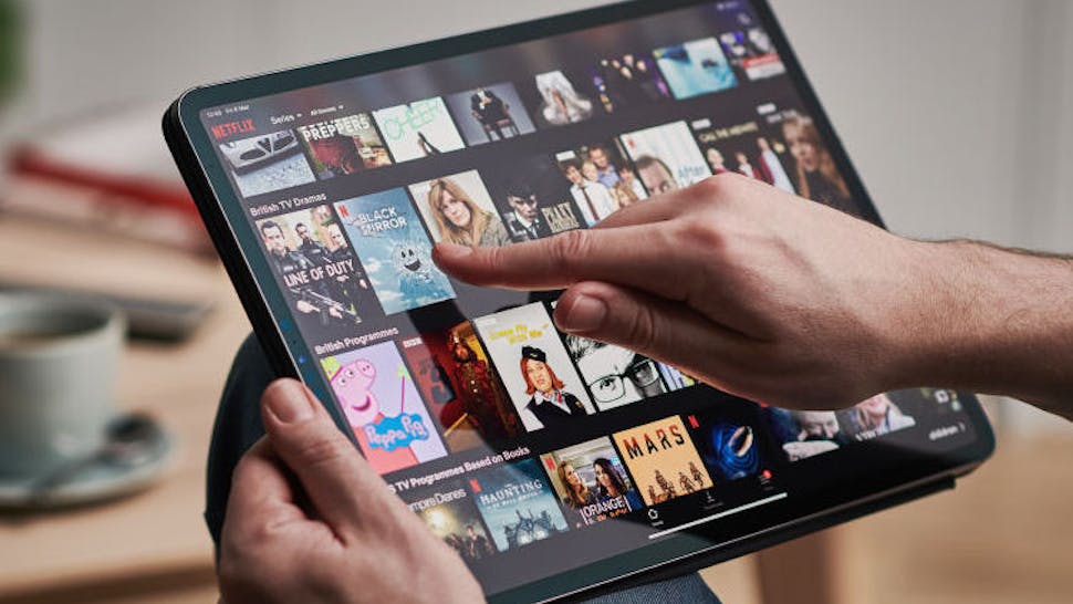 Detail of a man’s hand scrolling through Netflix on an Apple iPad Pro, taken on March 6, 2020. (Photo by Phil Barker/Future Publishing via Getty Images)