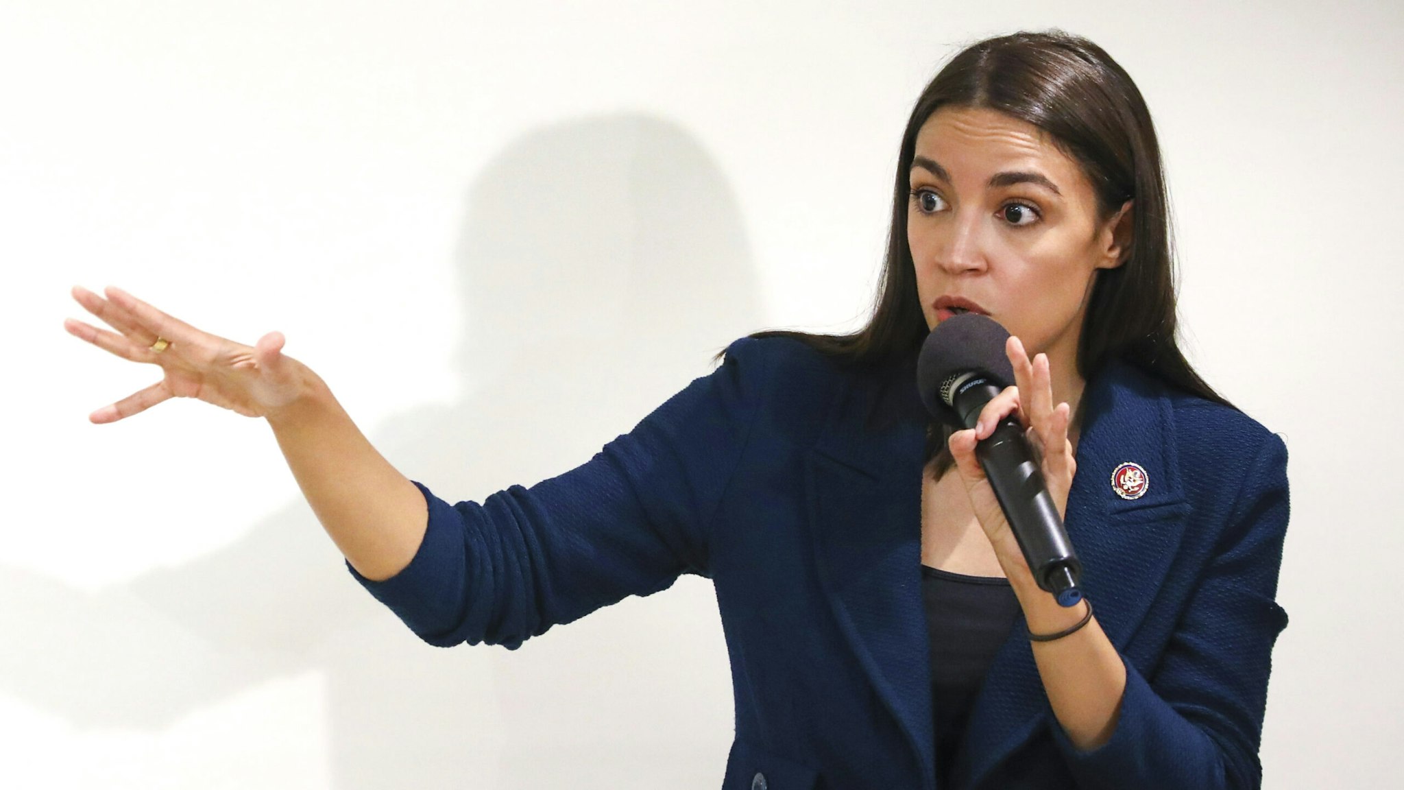 NEW YORK, NY - OCTOBER 03: U.S. Rep. Alexandria Ocasio-Cortez (D-NY) speaks during a town hall meeting at the LeFrak City Queens Library on October 3, 2019 in the Queens borough of New York City. The event focused on her A Just Society legislation, which targets poverty, affordable housing, and access to federal benefits.
