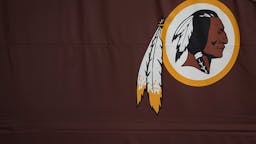 Amid Social And Corporate Pressure, Washington Redskins Consider Name Change LANDOVER, MD - JULY 07: A Washington Redskins logo is seen on the outside of FedEx Field on July 7, 2020 in Landover, Maryland. After receiving recent pressure from sponsors and retailers, the NFL franchise is considering a name change to replace Redskins. The term "redskin" is a dictionary-defined racial slur for Native Americans.