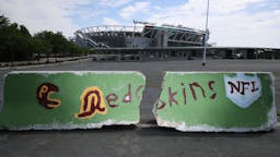 NFL Franchise Washington Redskins To Change Team Name After 87 Years LANDOVER, MARYLAND - JULY 13: A hand-painted concrete barrier stands in the parking lot of FedEx Field, home of the NFL's Washington Redskins team July 13, 2020 in Landover, Maryland. The team announced Monday that owner Daniel Snyder and coach Ron Rivera are working on finding a replacement for its racist name and logo after 87 years.