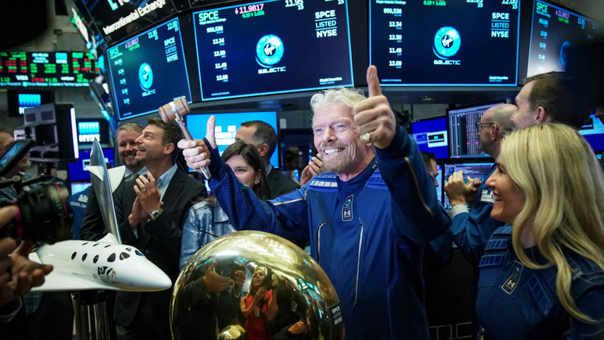NEW YORK, NY - OCTOBER 28:  Sir Richard Branson, Founder of Virgin Galactic, gives the thumbs up after ringing a ceremonial bell on the floor of the New York Stock Exchange (NYSE) to promote the first day of trading of Virgin Galactic Holdings shares on October 28, 2019 in New York City. Virgin Galactic Holdings became the first space-tourism company to go public as it began trading on Monday with a market value of about $1 billion. (Photo by Drew Angerer/Getty Images)
