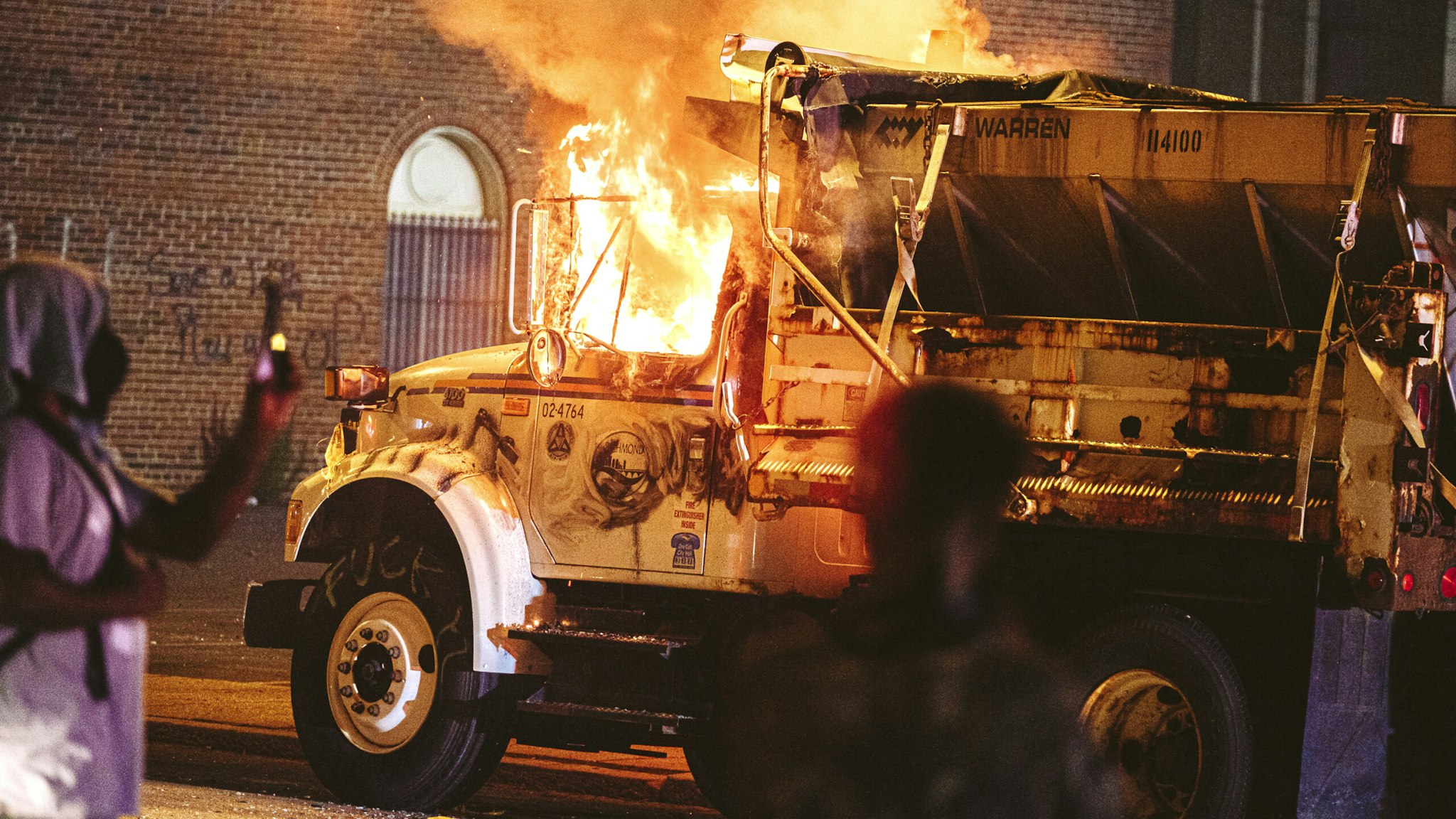 A parked truck is set on fire on July 25, 2020 in Richmond, Virginia. Protesters in Richmond took to the streets to join other protesters around the country for the Stand With Portland rally in support of the Black Lives Matter protesters in Portland, Oregon.