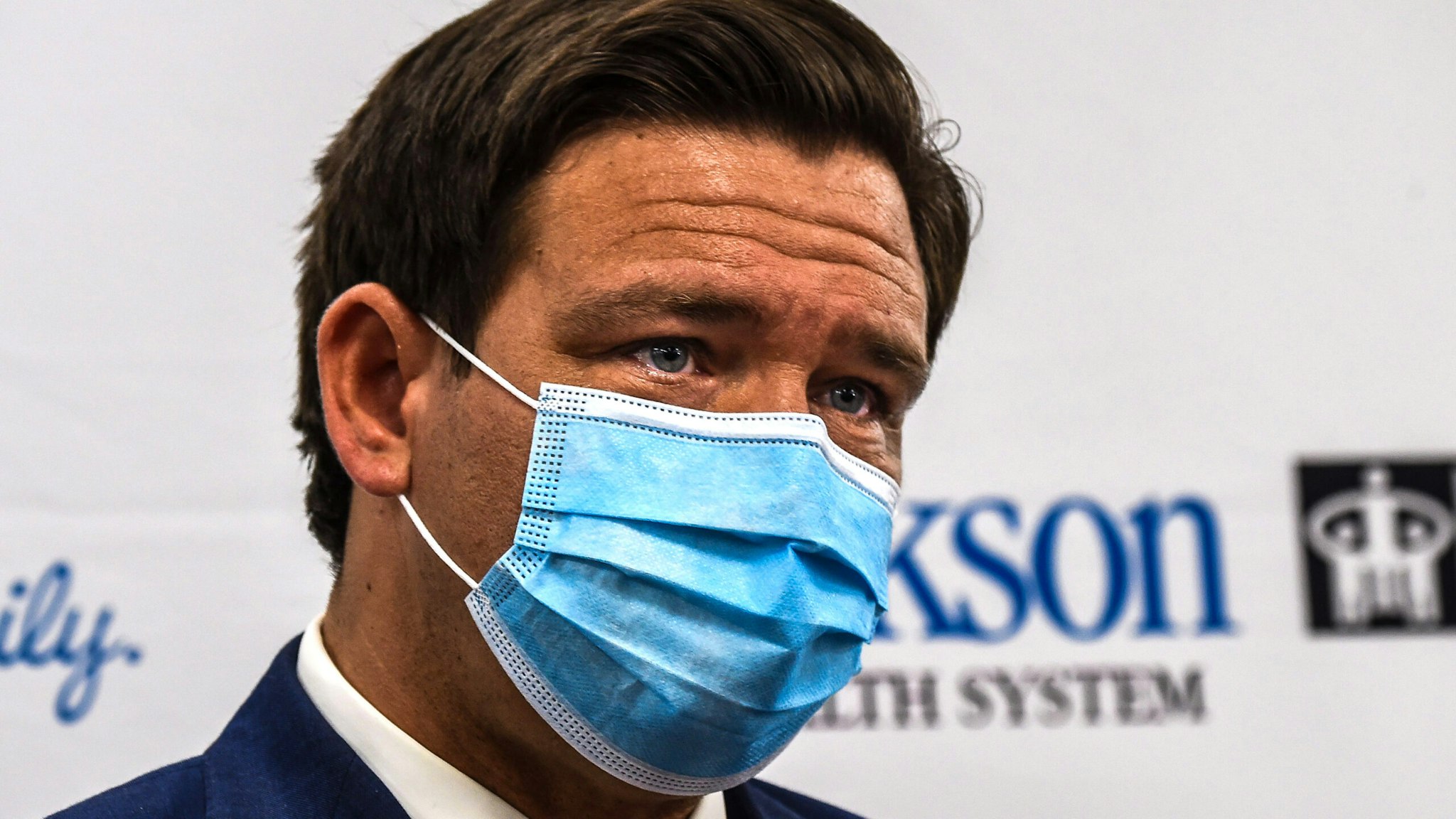 Florida Gov. Ron DeSantis wears a facemask during a press conference to address the rise of coronavirus cases in the state, at Jackson Memorial Hospital in Miami, on July 13, 2020. - Virus epicenter Florida saw 12,624 new cases on July 12 -- the second highest daily count recorded by any state, after its own record of 15,300 new COVID-19 cases a day earlier.