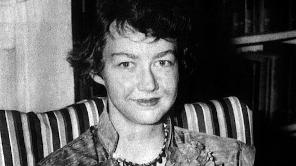 American writer Flannery O'Connor (1925-1964) with her book 'Wise Blood' 1952