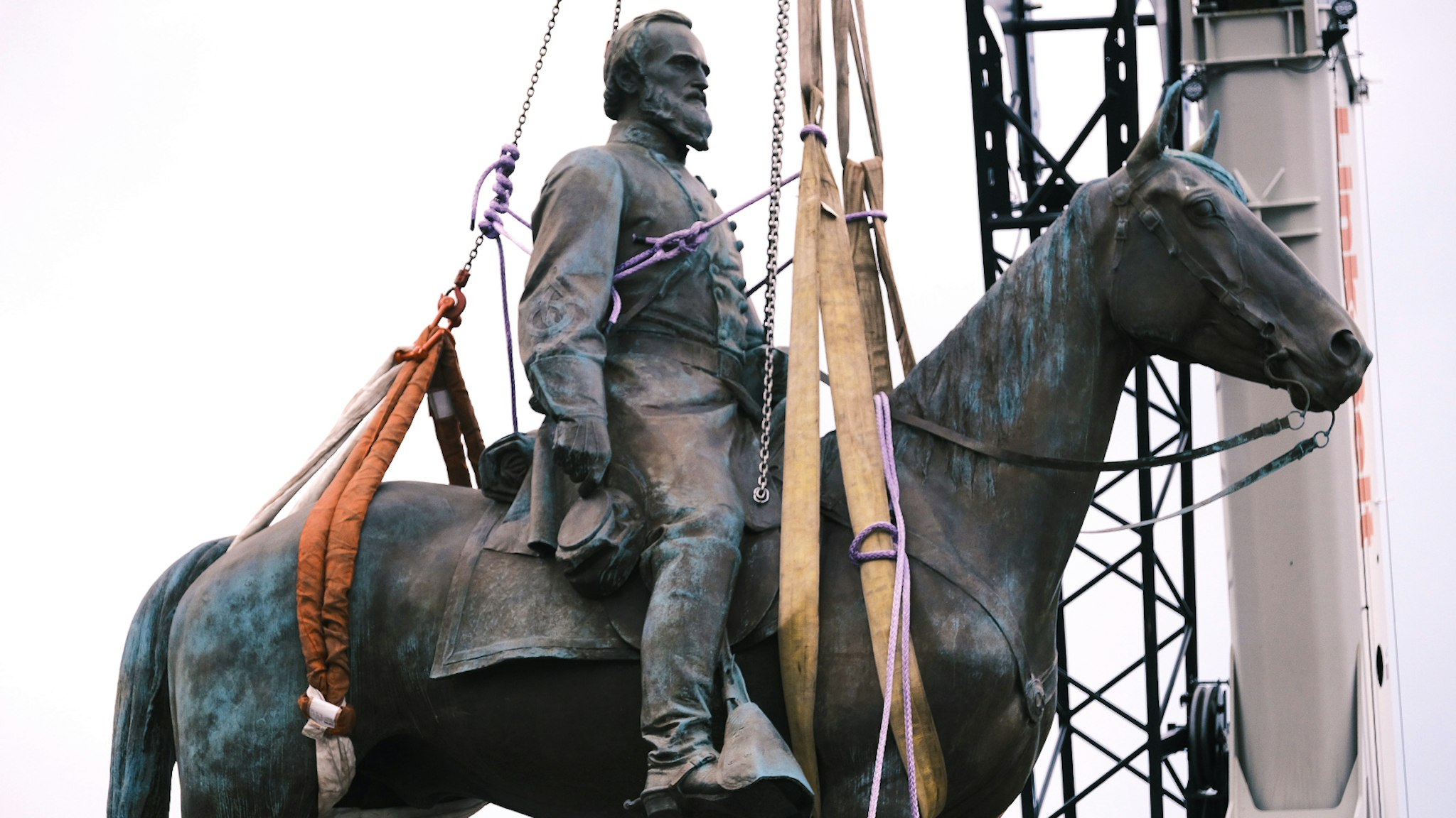 RICHMOND, VA - JULY 01: The Stonewall Jackson Monument in Richmond Virginia as it is being removed off by a crane on July 1, 2020 in Richmond, Virginia. Mayor Levar Stoney ordered the removal of all Confederate statues from city land.