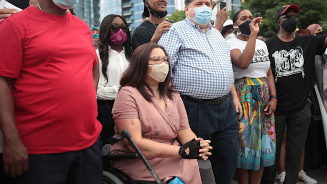 CHICAGO, ILLINOIS - JUNE 19: Senator Tammy Duckworth (D-IL) participates with Illinois Governor J.B. Pritzker in a Juneteenth march organized by faith leaders on June 19, 2020 in Chicago, Illinois. Juneteenth commemorates June 19, 1865, when a Union general read orders in Galveston, Texas stating all enslaved people in Texas were free according to federal law. (Photo by Scott Olson/Getty Images)