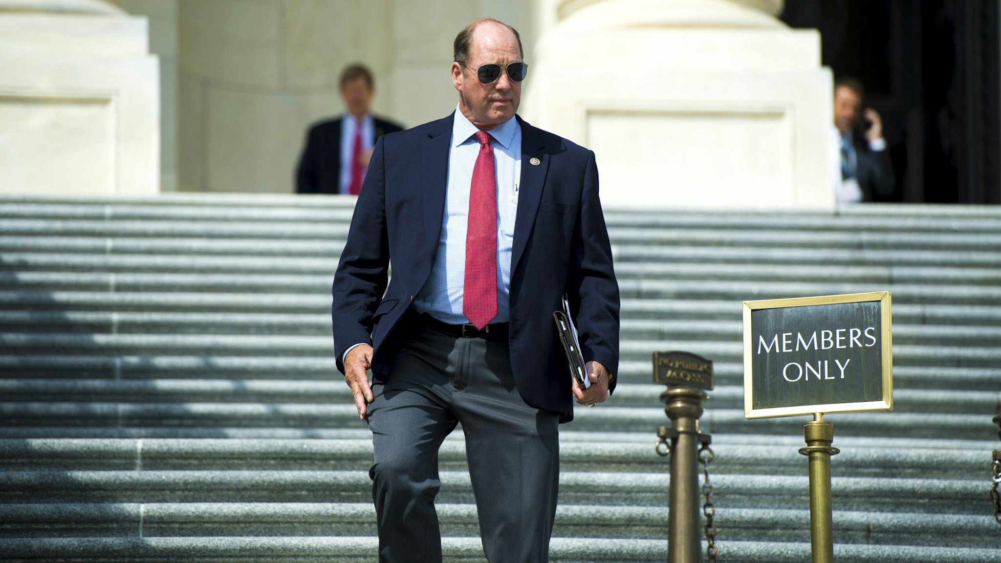 UNITED STATES - SEPTEMBER 7: Rep. Ted Yoho, R-Fla., walks down the House steps after the last vote of the week on Friday, Sept. 7, 2018.