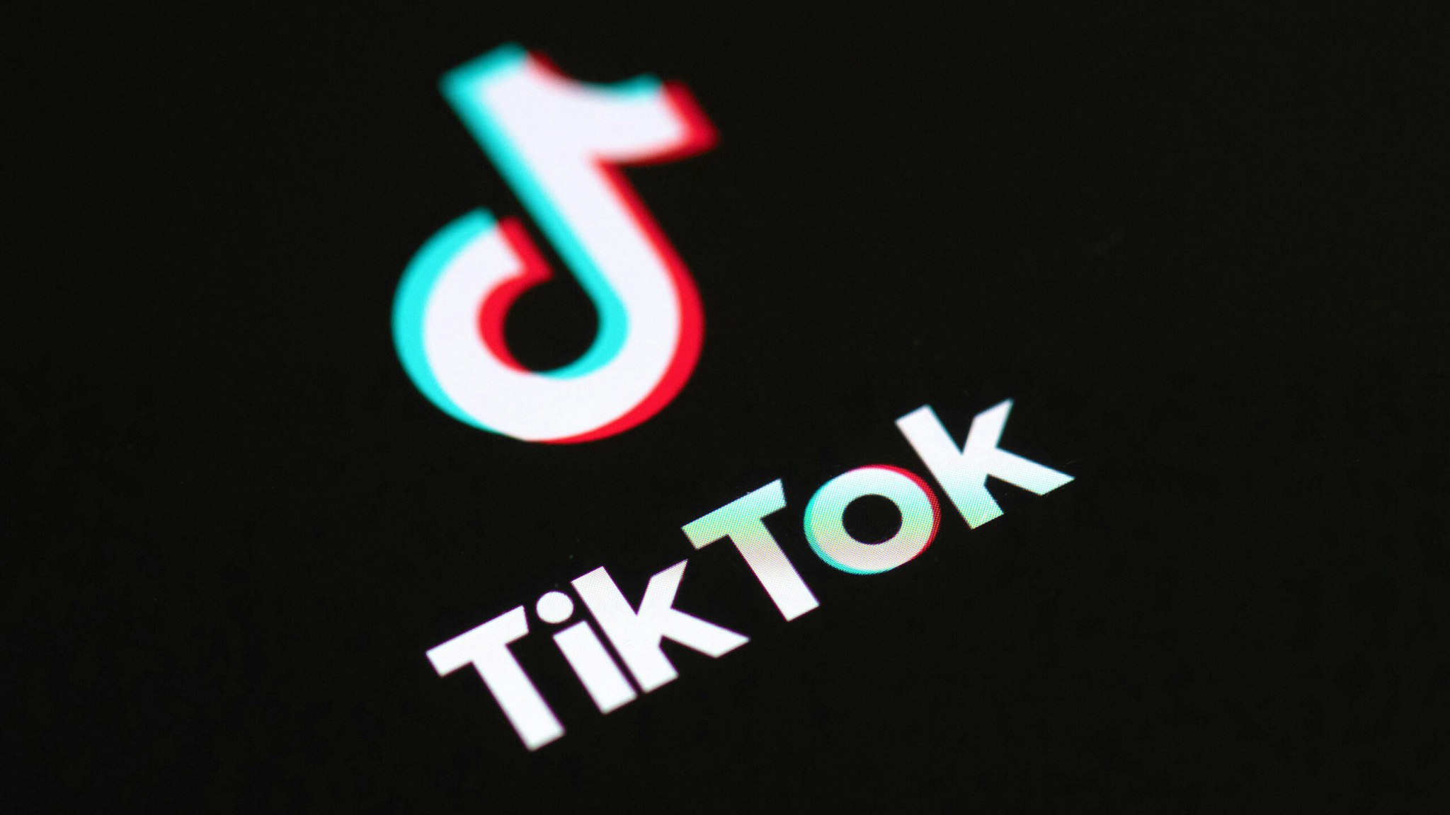 This illustration picture taken on May 27, 2020 in Paris shows the logo of the social network application Tik Tok on the screen of a phone.
