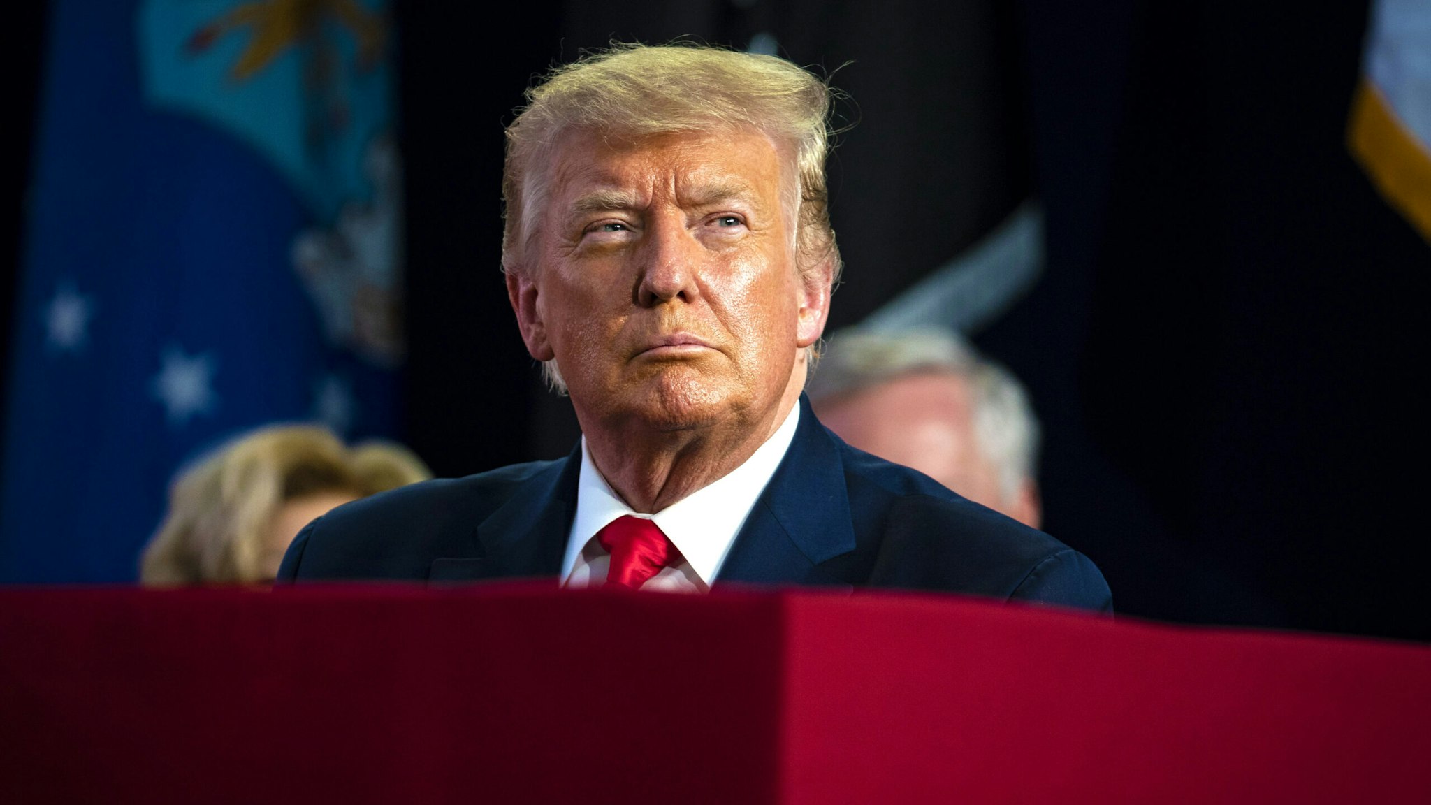 U.S. President Donald Trump attends during an event at Mount Rushmore National Memorial in Keystone, South Dakota, U.S., on Friday, July 3, 2020. The early Independence Day celebration, which will feature a military flyover and the first fireworks in more than a decade, is expected to include about 7,500 ticketed guests who won't be required to wear masks or socially distance despite a spike in U.S. coronavirus cases.