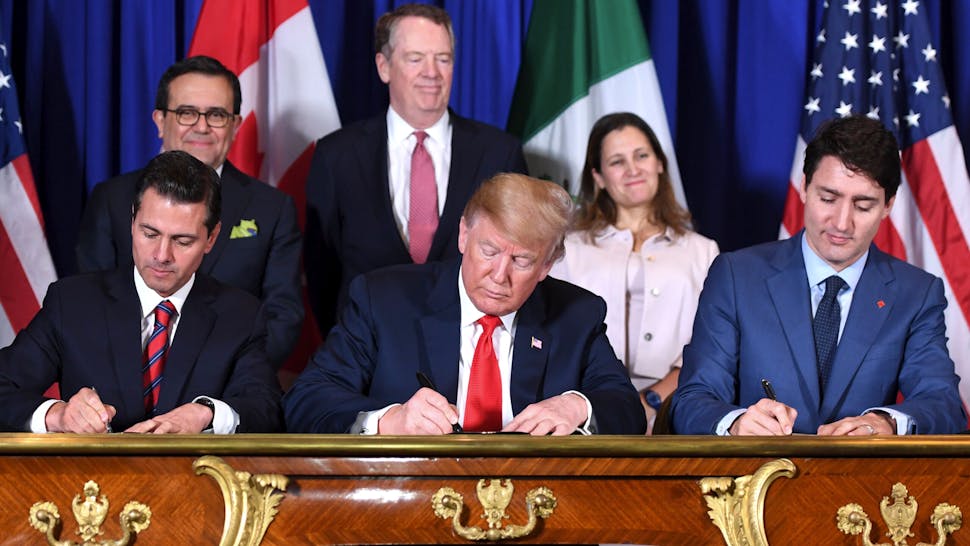 Donald Trump Mexico's President Enrique Pena Nieto (L) US President Donald Trump (C) and Canadian Prime Minister Justin Trudeau, sign a new free trade agreement in Buenos Aires, on November 30, 2018, on the sidelines of the G20 Leaders' Summit. - The revamped accord, called the US-Mexico-Canada Agreement (USMCA), looks a lot like the one it replaces. But enough has been tweaked for Trump to declare victory on behalf of the US workers he claims were cheated by NAFTA.